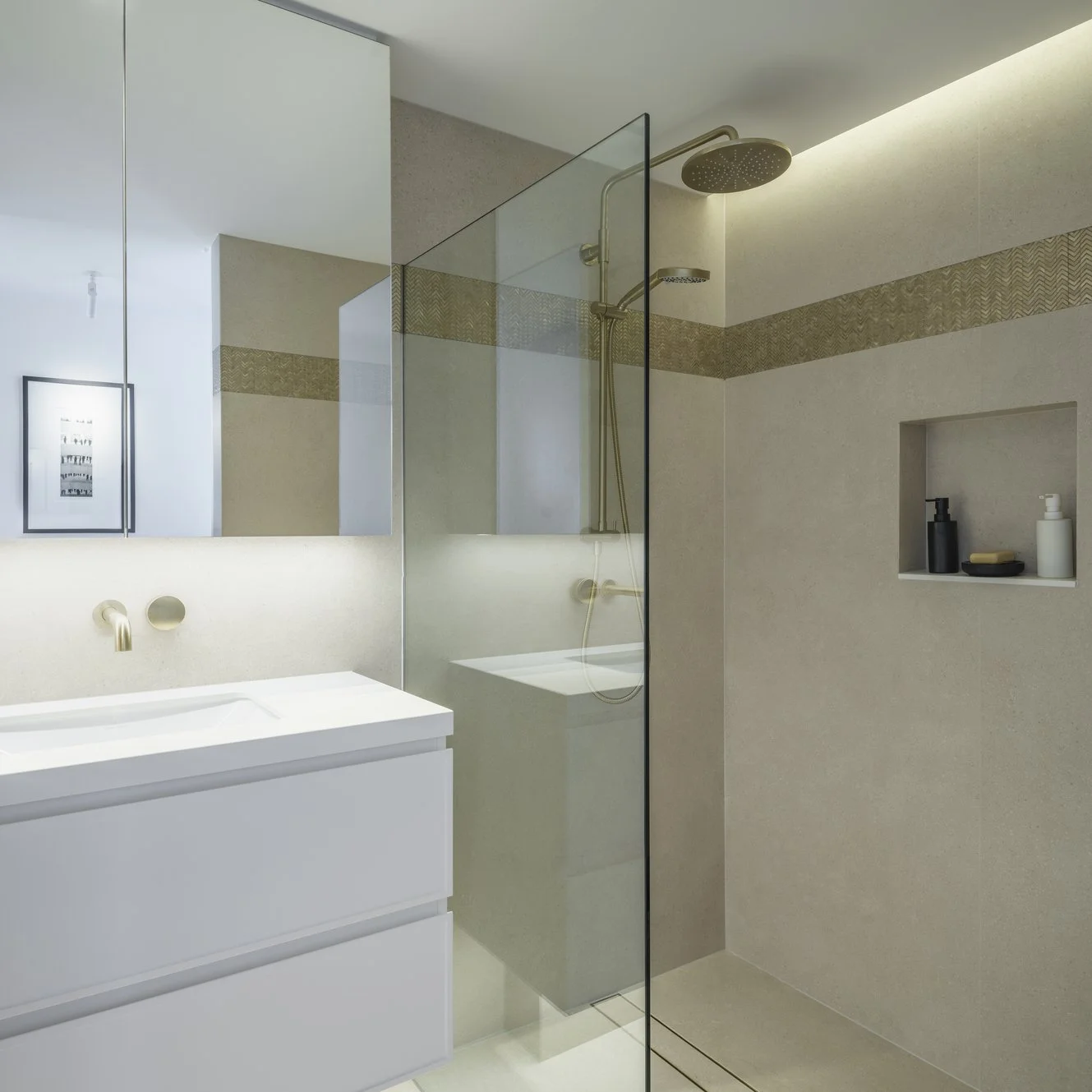 Potts Point Unit 2024 — high-end apartment renovation in Sydney featuring bespoke joinery, herringbone timber flooring with brass inlay, integrated lighting and a cohesive open-plan kitchen, living and dining space.