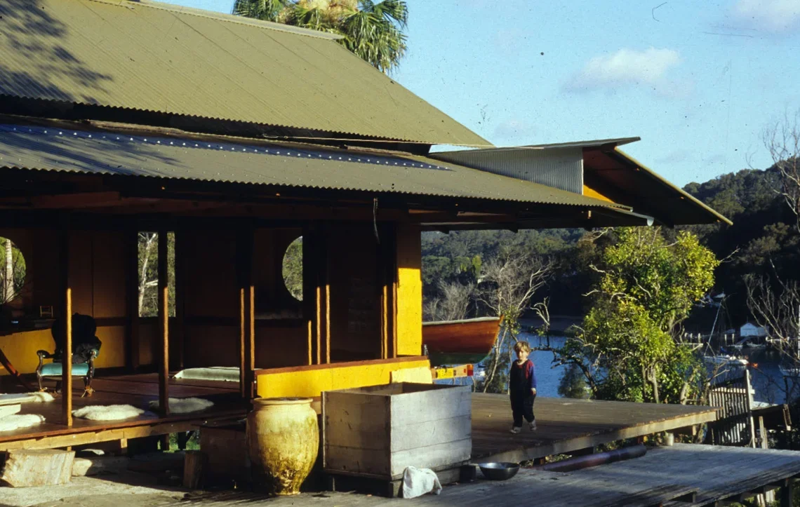Exterior deck of Lovett Bay House overlooking Pittwater, showing the open corner, timber structure and connection to the surrounding landscape.