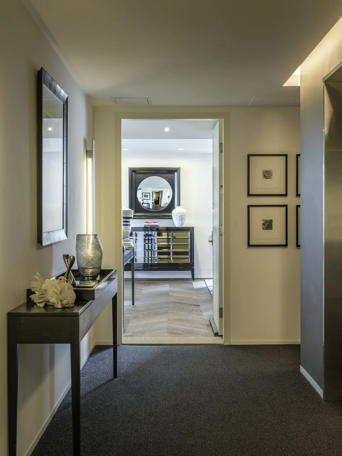 Potts Point Unit 2024 — high-end apartment renovation in Sydney featuring bespoke joinery, herringbone timber flooring with brass inlay, integrated lighting and a cohesive open-plan kitchen, living and dining space.