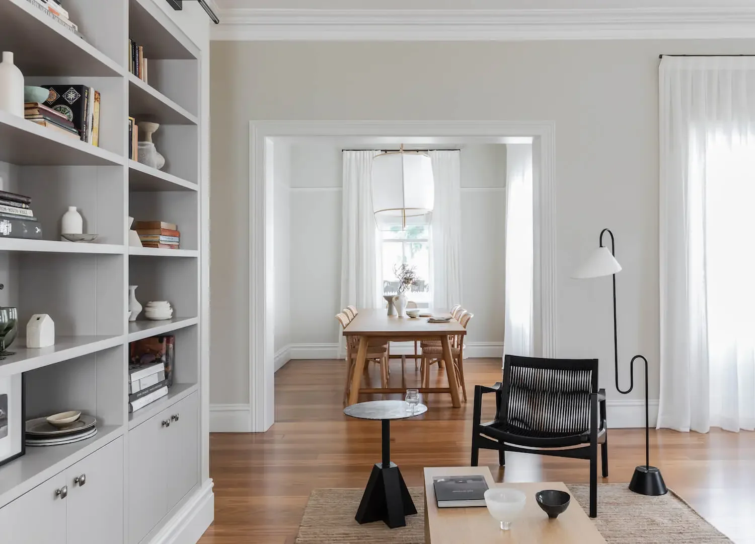 Heritage renovation interior in Hunters Hill with timber floors, custom shelving and contemporary dining space.