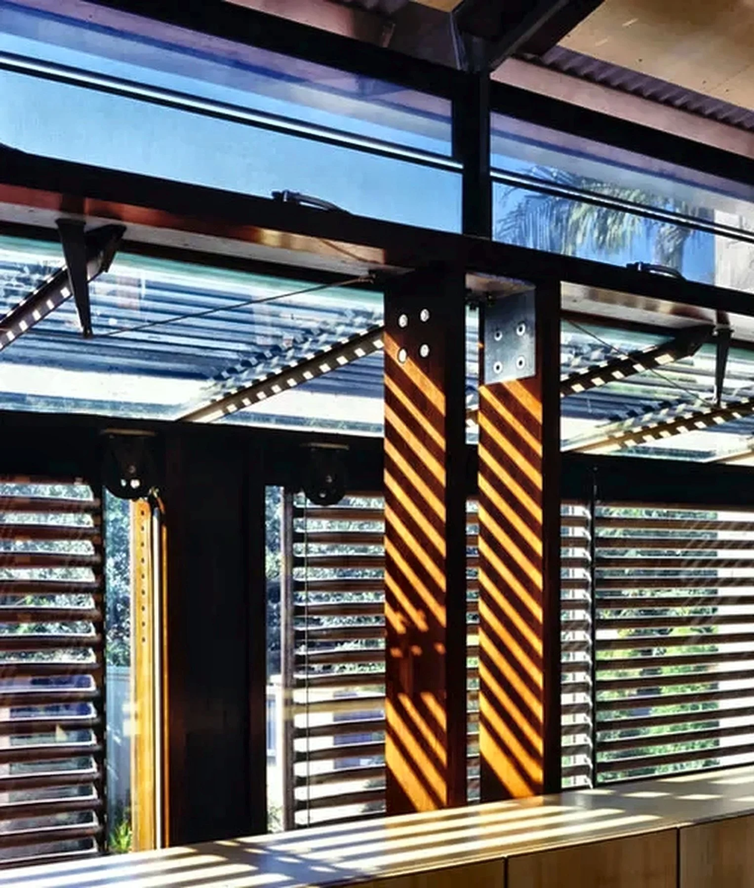 Designed by Peter Stutchbury.  Sunlight streams through a window.