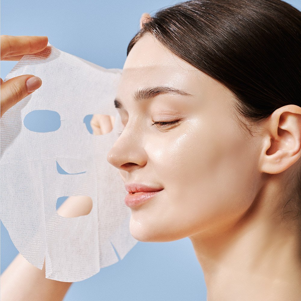 Dermathod Derma Revive Triple Action Mask mask being applied to face.jpg