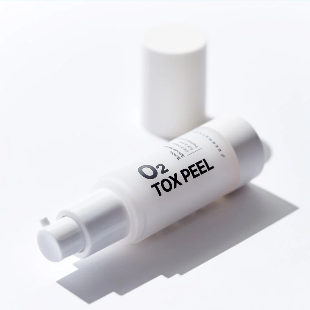 Dermathod O2 Tox Peel bottle laying on side with lid off.jpg