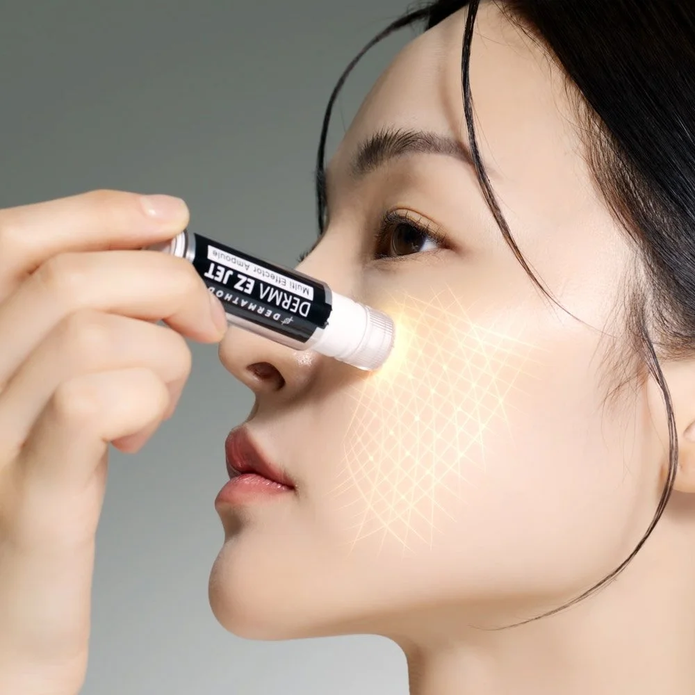 Dermathod EZ Jet Mela Glow Kit ampoule being applied to face.jpg