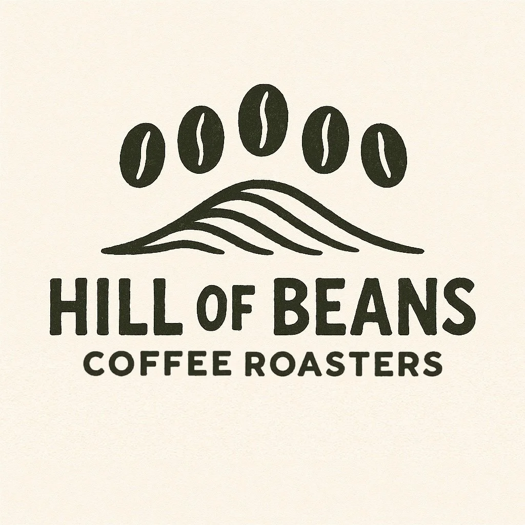 Logo for Hill of Beans Coffee Roasters featuring five coffee beans above wavy lines and the text 'HILL OF BEANS COFFEE ROASTERS'.
