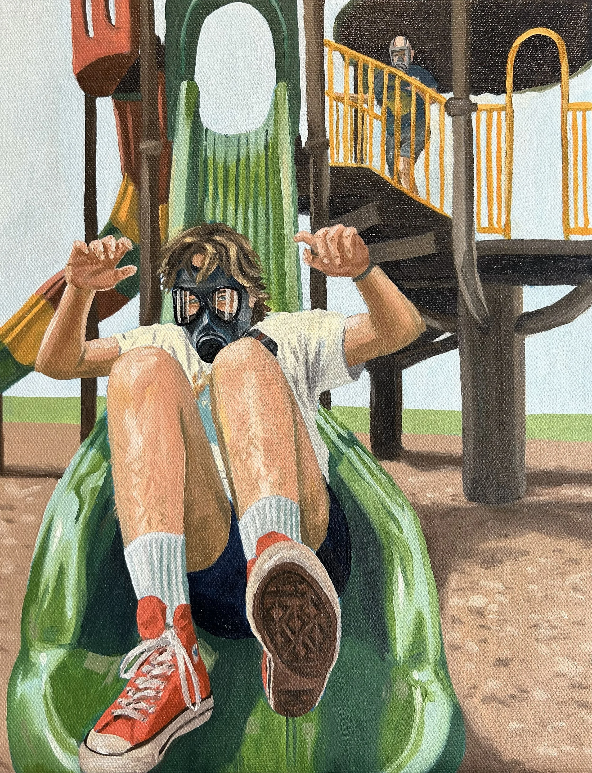 A person in a gas mask going down a long green slide at a playground with another figure in the background also donning a gas mask.