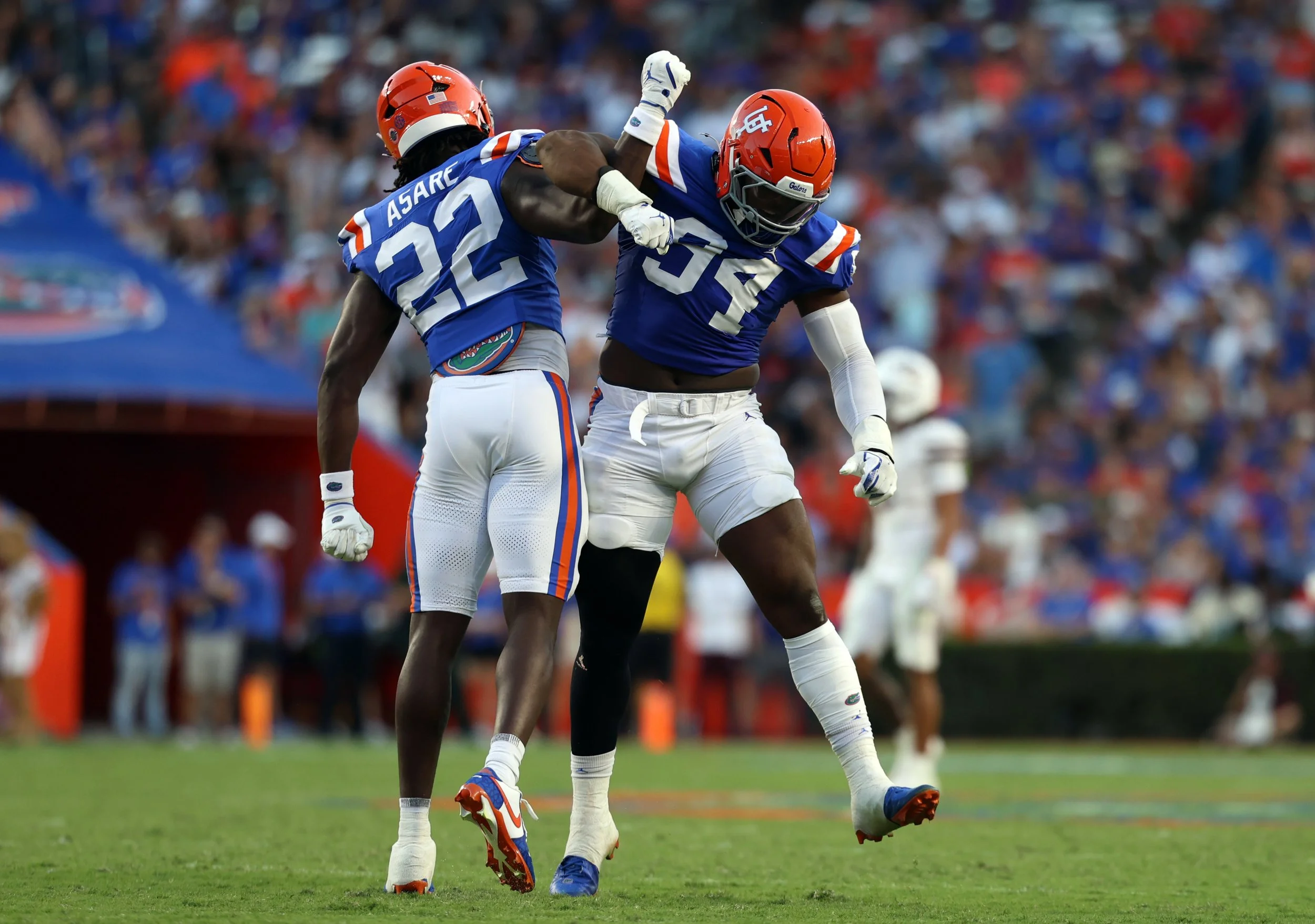 Kofi Asare (#22) and Tyreak Sapp (#94) celebrate on the field during the Gators’ game against the Mississippi State Bulldogs at Ben Hill Griffin Stadium in Gainesville, Fla., Saturday night, Oct. 18, 2025.