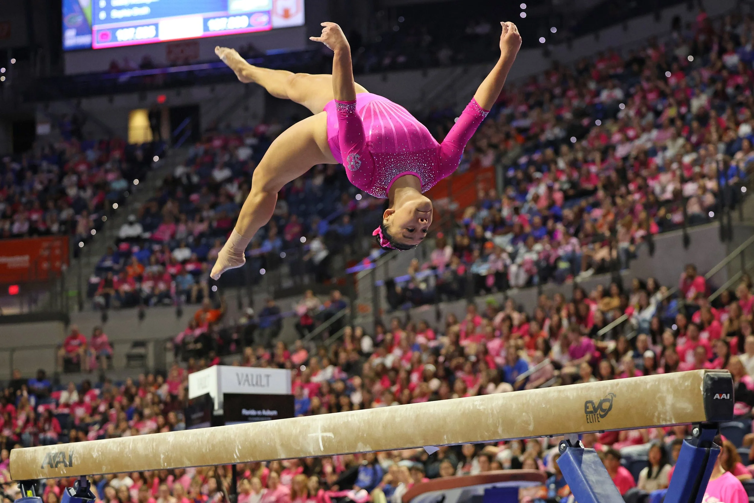 Leanne Wong backflips during her balance beam routine during UF gymnastics' meet against Auburn at the Stephen C. O’Connell Center in Gainesville, Fla., on Friday, Feb. 14, 2025.