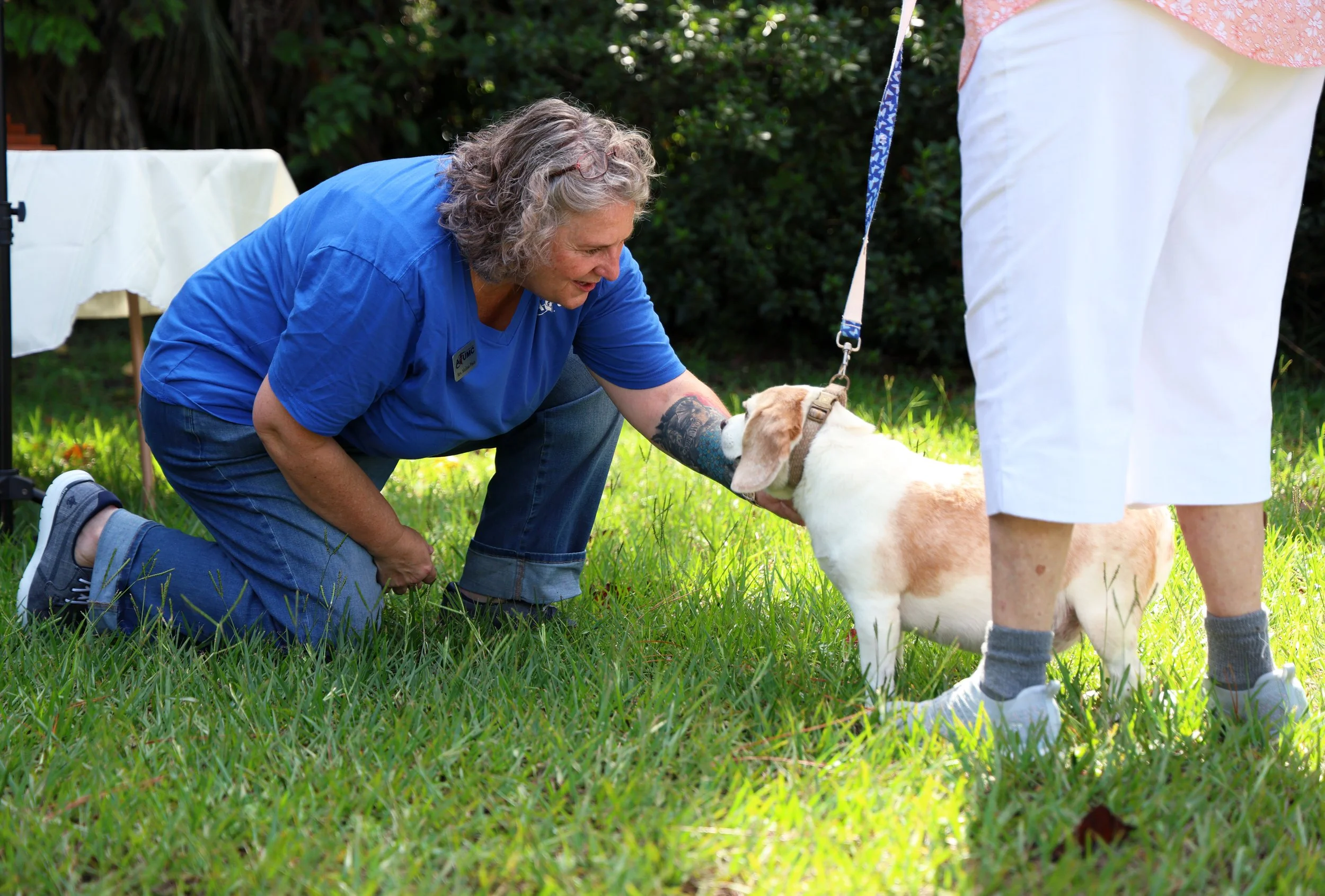 Rev. Melissa Pisco bestows a blessing upon Tally, a beagle, during the Blessing of the Pets service at First Archer United Methodist Church in Archer, Fla., on Sunday, Sept. 28, 2025.