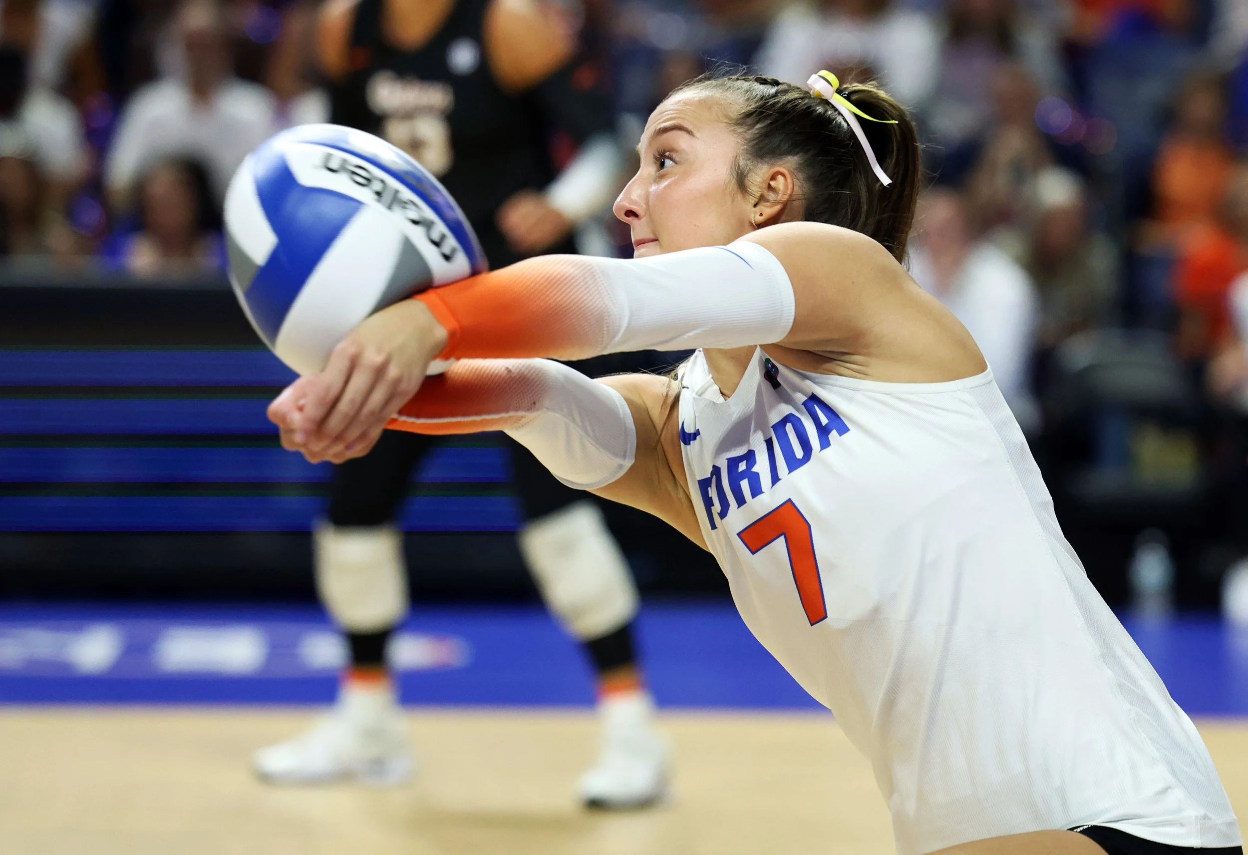 Emily Canaan bumps the ball to another player for a kill against Auburn during an NCAA volleyball match at the Stephen C. O’Connell Center in Gainesville, Fla., on Friday, Oct. 3, 2025.