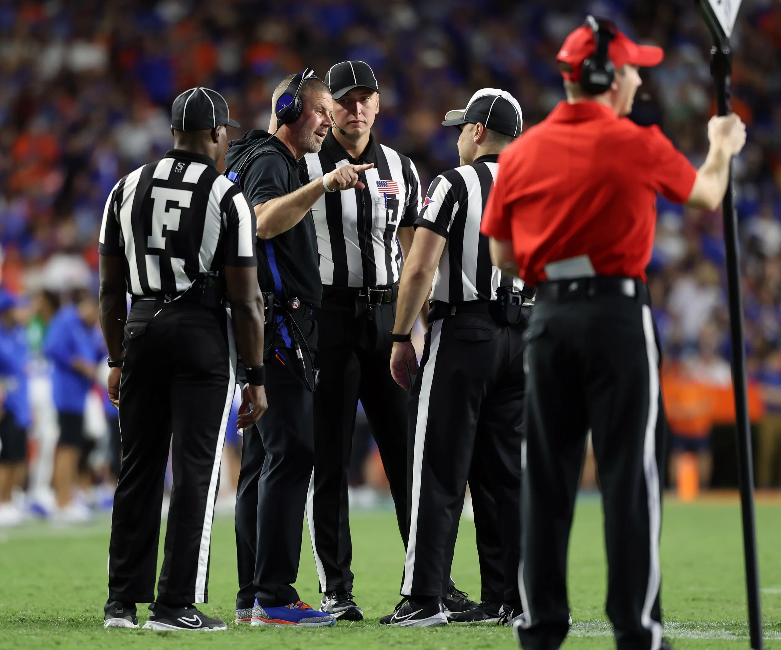 University of Florida head coach Billy Napier speaks with officials on the sideline during the Gators’ game against Mississippi State at Ben Hill Griffin Stadium in Gainesville, Fla., Saturday night, Oct. 18, 2025.