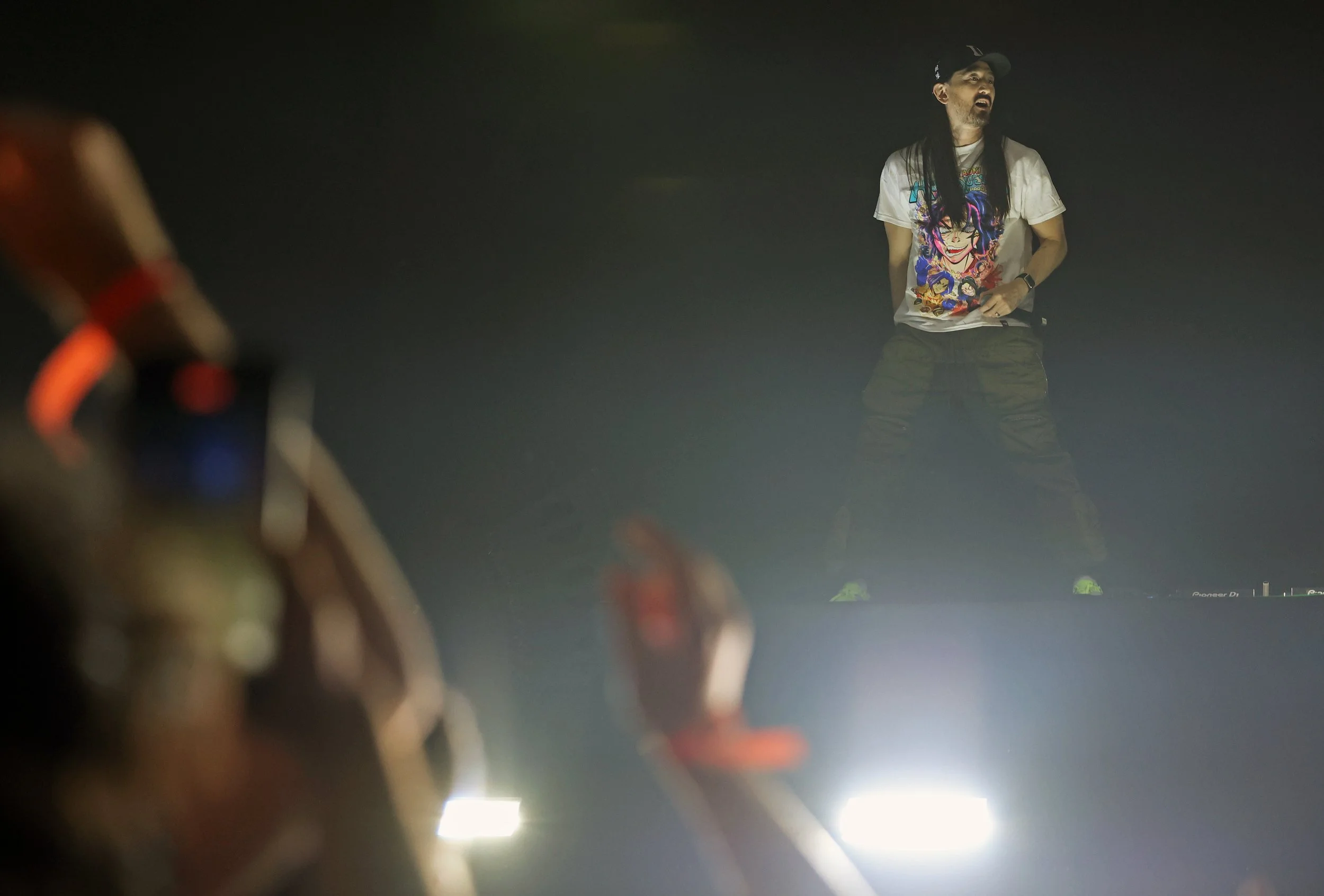 Steve Aoki stands on the DJ table during his set at the University of Florida’s Gator Growl at the O’Connell Center on Friday, Oct. 17, 2025.