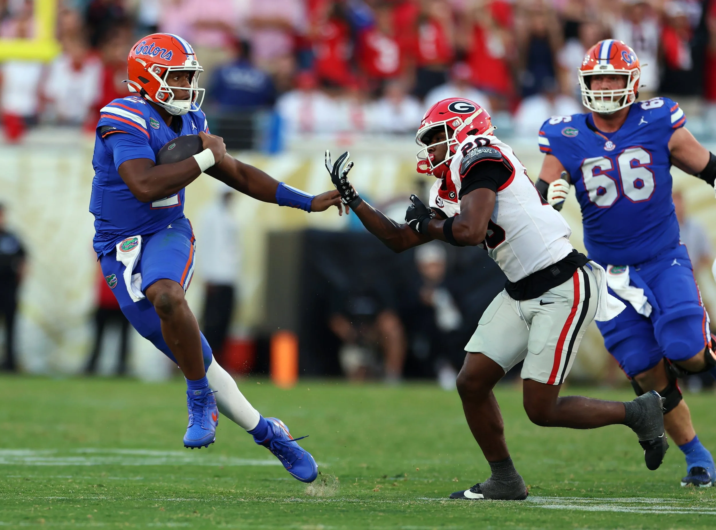 Florida’s DJ Lagway runs with the ball while avoiding a tackle during Florida’s game against Georgia on Saturday, Nov. 1, 2025, at EverBank Stadium in Jacksonville, Fla.