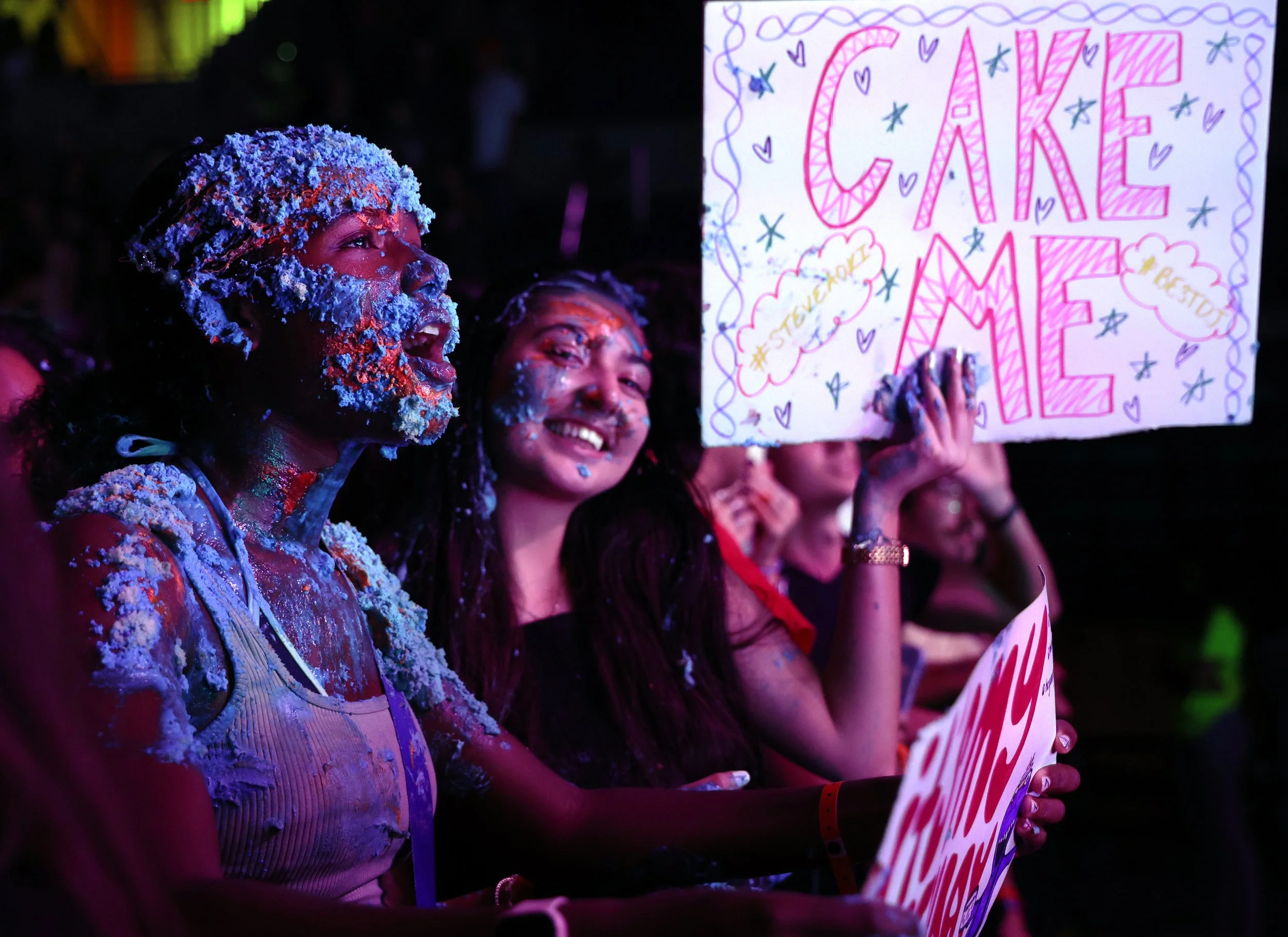 An attendee sings along to one of the final songs of the night after Steve Aoki threw a cake at her during the University of Florida’s Gator Growl at the O’Connell Center on Friday, Oct. 17, 2025.