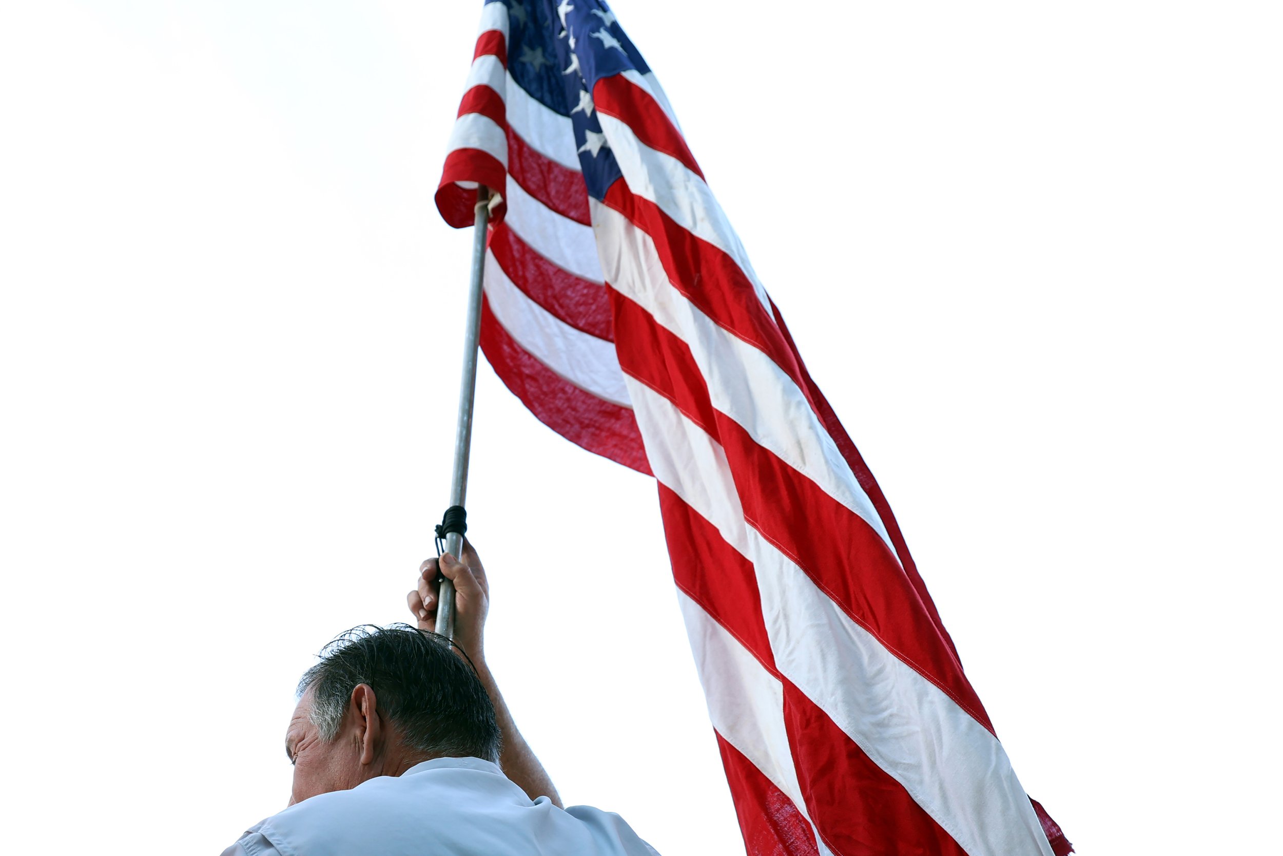 Ben Pollock holds an American flag during the protest to release Jeremy Brown in Tampa, Fla., on Thursday, Jan. 30, 2025. 