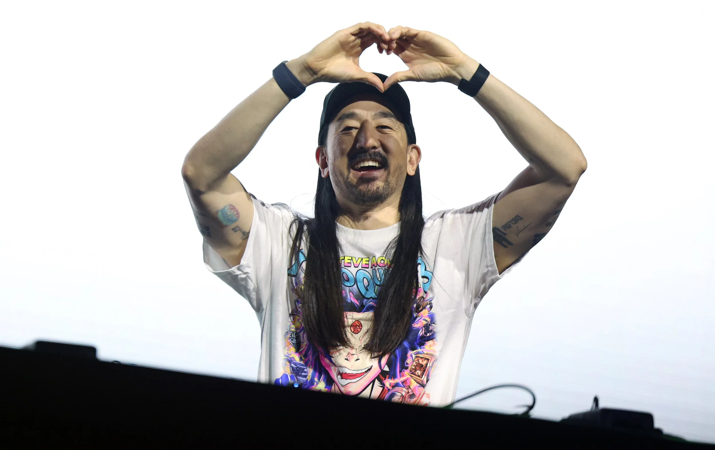 Steve Aoki forms a heart with his hands toward the audience during his set at the University of Florida’s Gator Growl at the O’Connell Center on Friday, Oct. 17, 2025.