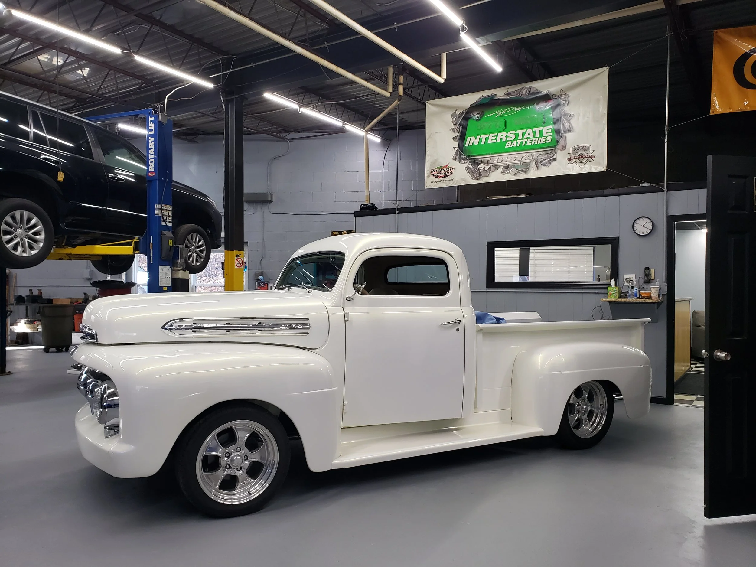 A vintage white Ford F100 Pick Up truck that was built by the owner, Jason Farino of Towne Auto Repair formerly Pete's Auto Repair in Randolph, NJ.
