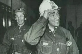 Two women in uniform, one smiling and the other adjusting her glasses, in a setting that appears to be indoors.