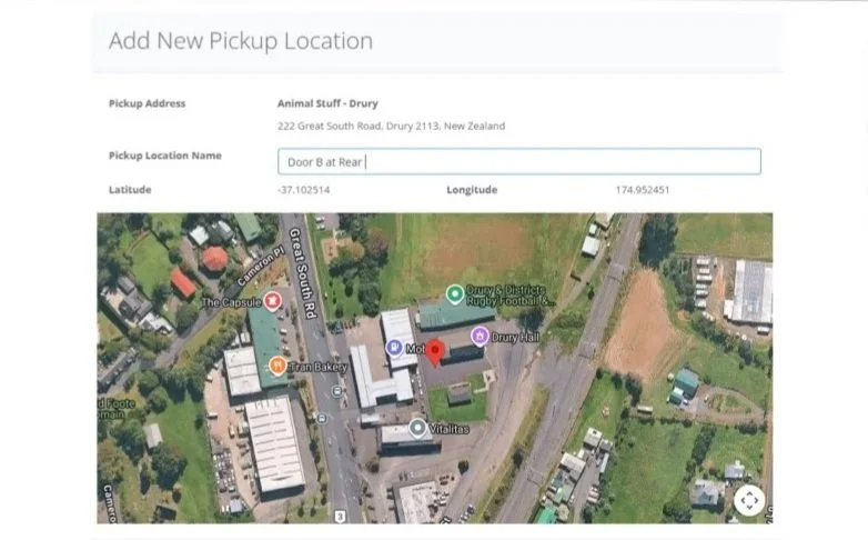 A map view showing locations in Drury, New Zealand, including The Capsule, Bran Bakery, Vitalitas, and other landmarks, with a highlighted pickup point labeled Door B at Rear.