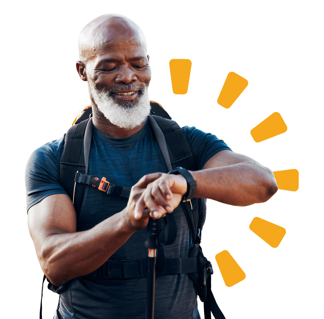 An older man with a gray beard and bald head, wearing a blue athletic shirt and hiking backpack, checks his watch while smiling, outdoors.
