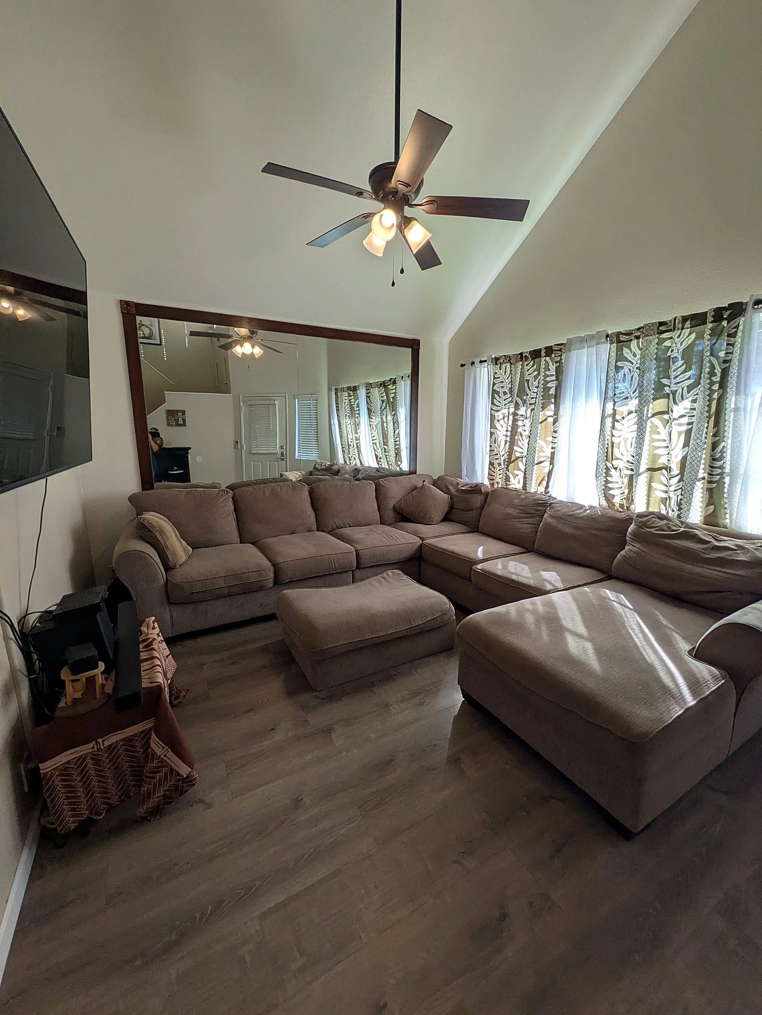 The living room opens straight through to dining and kitchen.