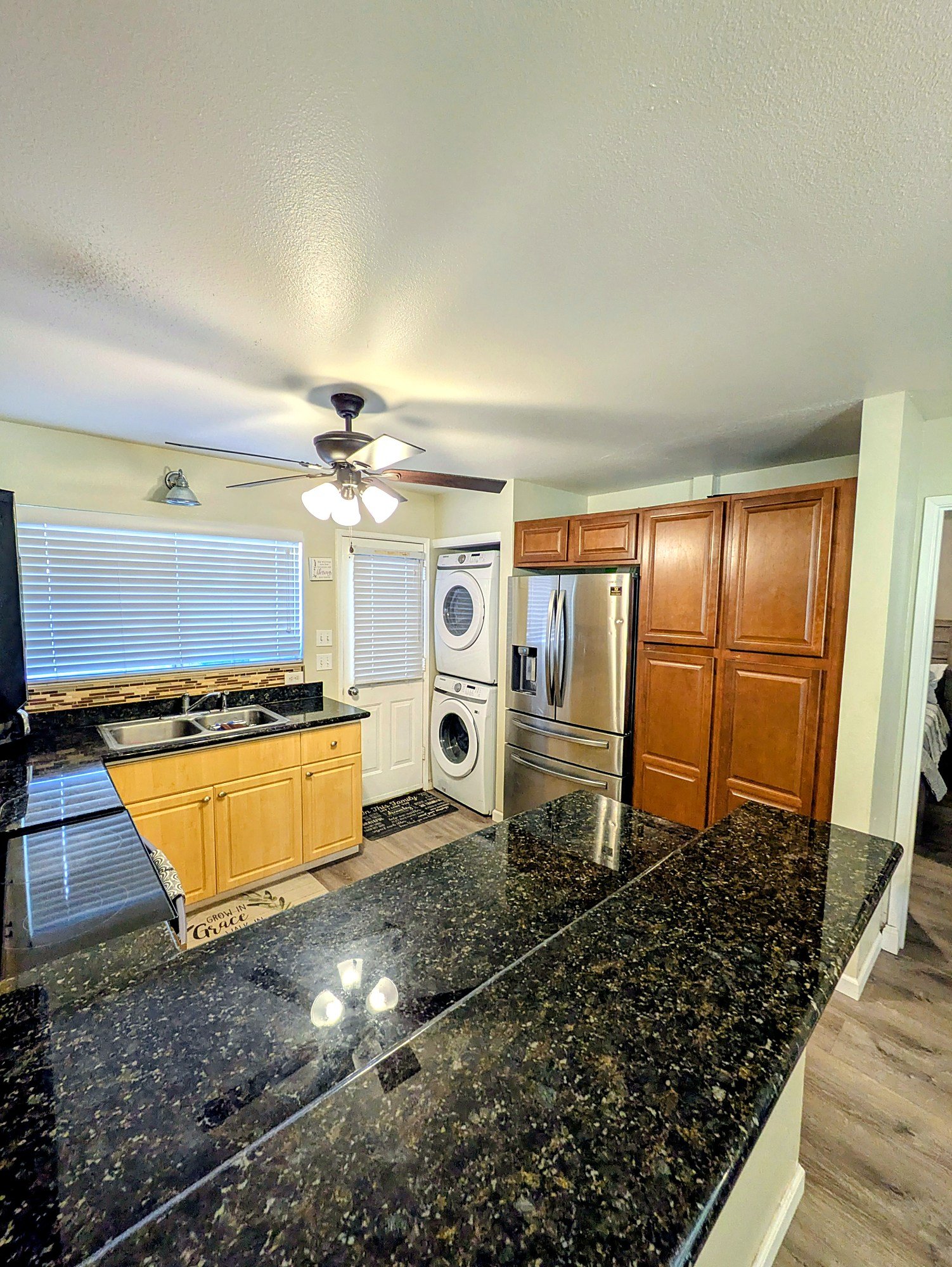 Laundry and a full-size refrigerator tucked in just off the kitchen.