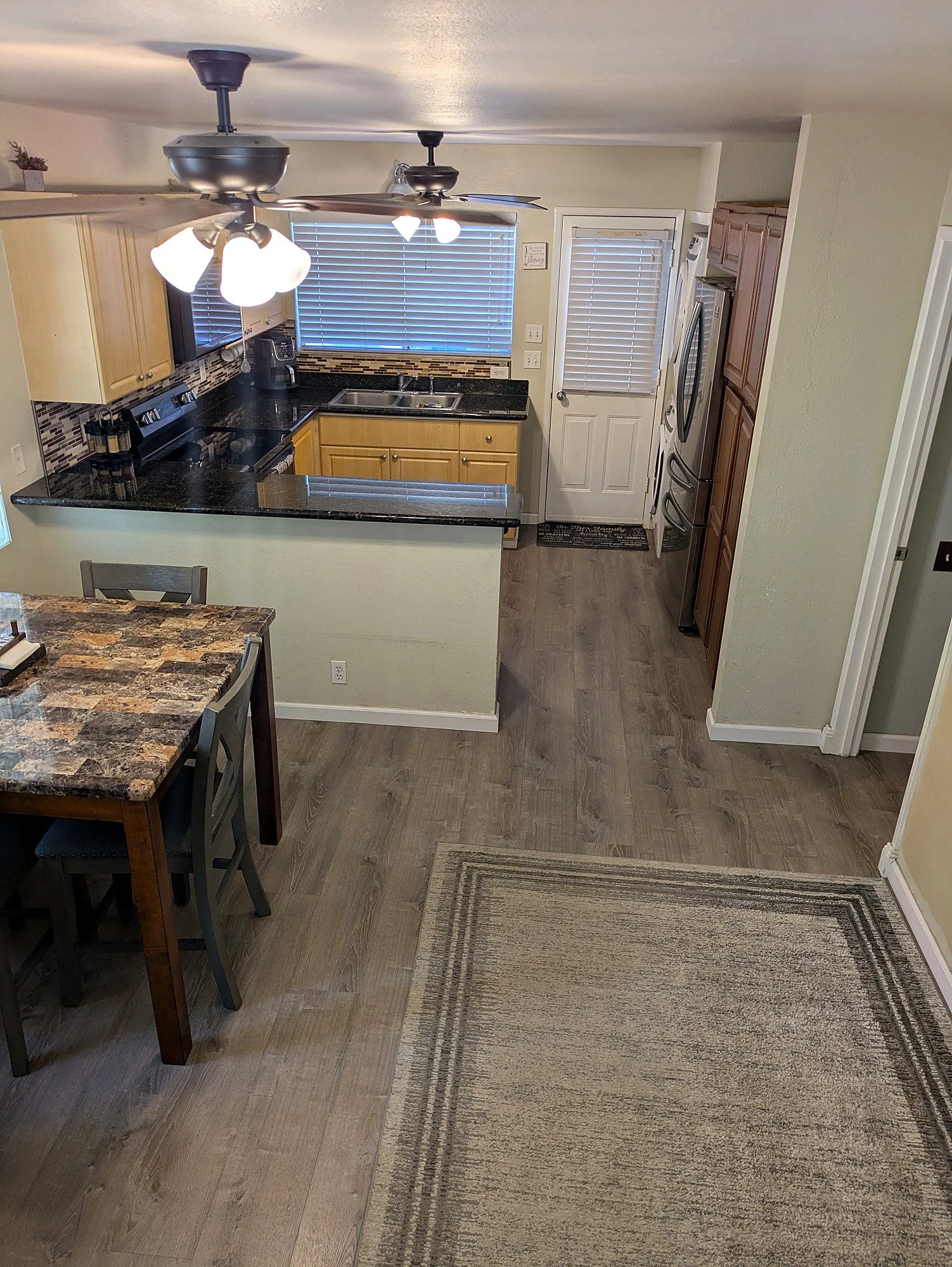 Dining sits between kitchen and living. Easy for weeknights, easy for hosting.