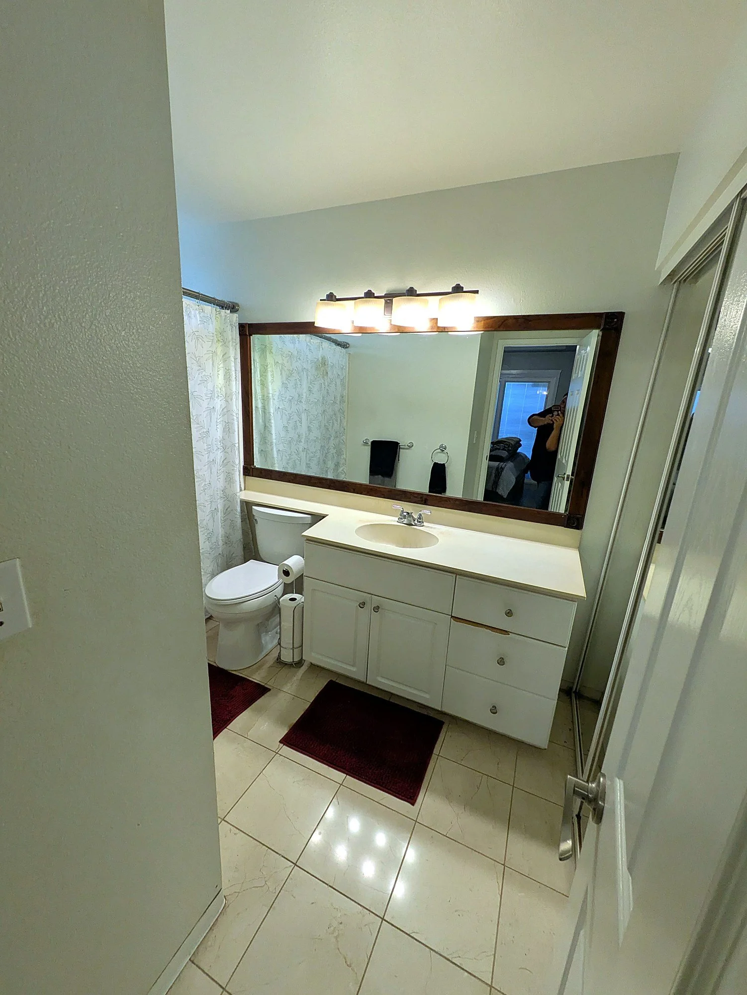 Full bath with a wide vanity and updated fixtures.