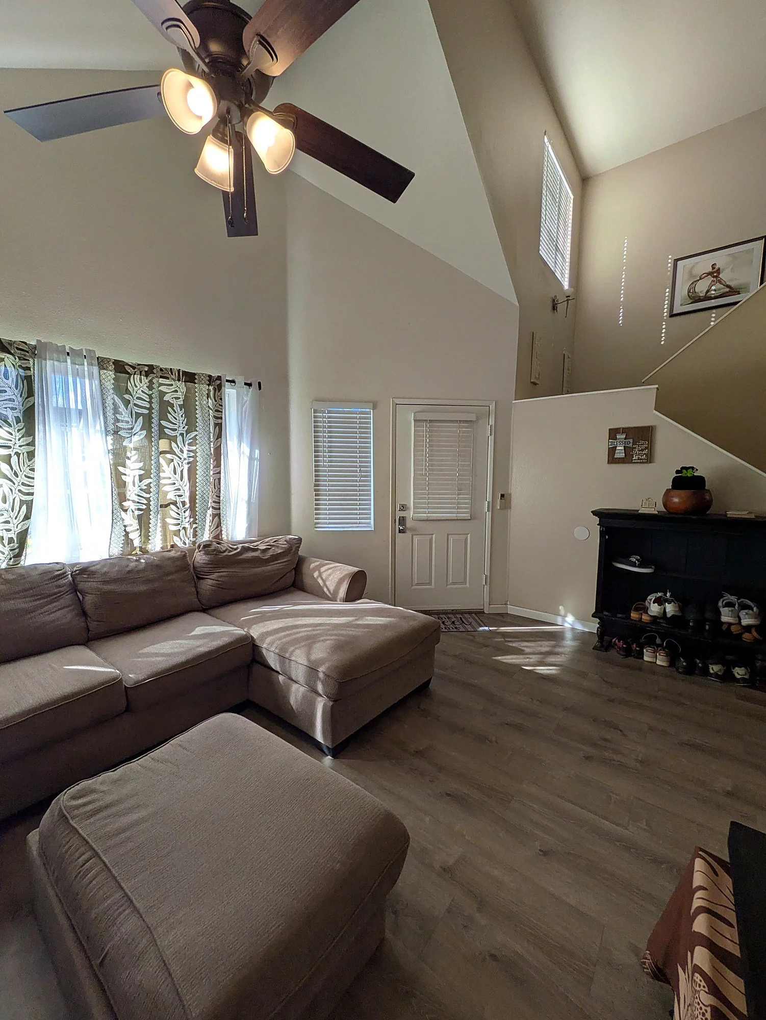 Vaulted ceiling with an exposed beam, taller than you expect from the street.