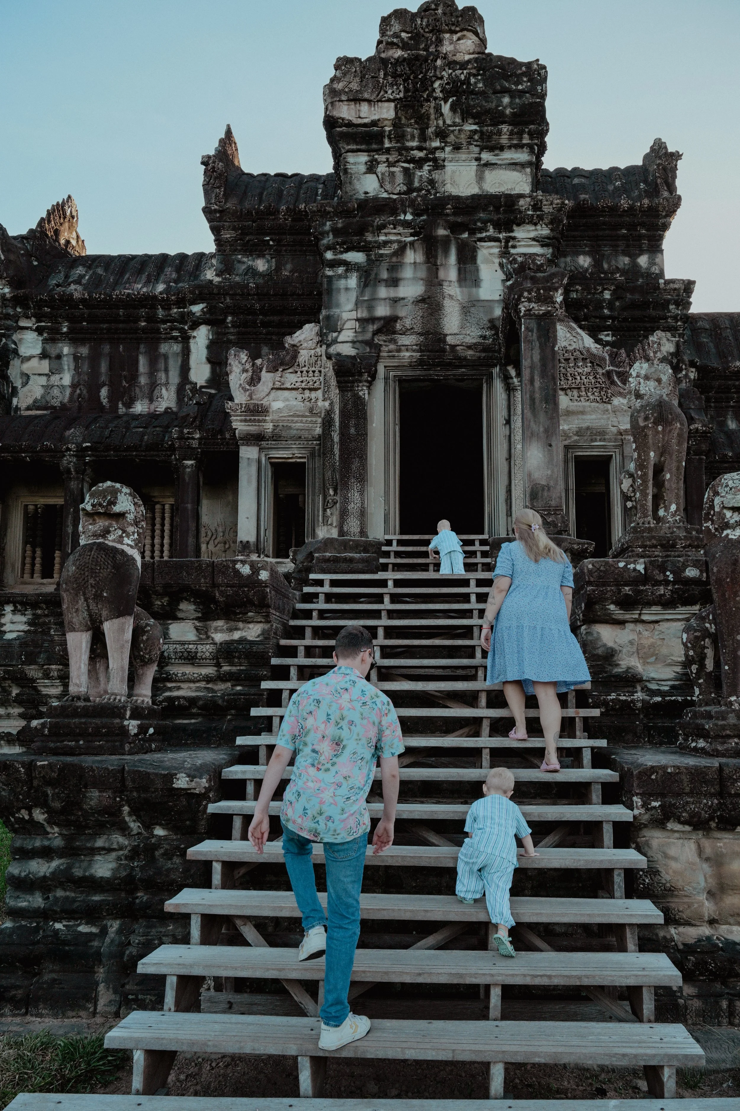 family exploring angkor wat temple in cambodia