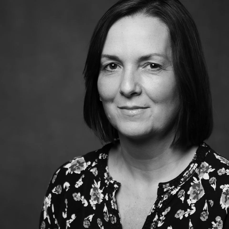 Black-and-white portrait of Elissa Simpson, CFO & Financial Modeling Expert.