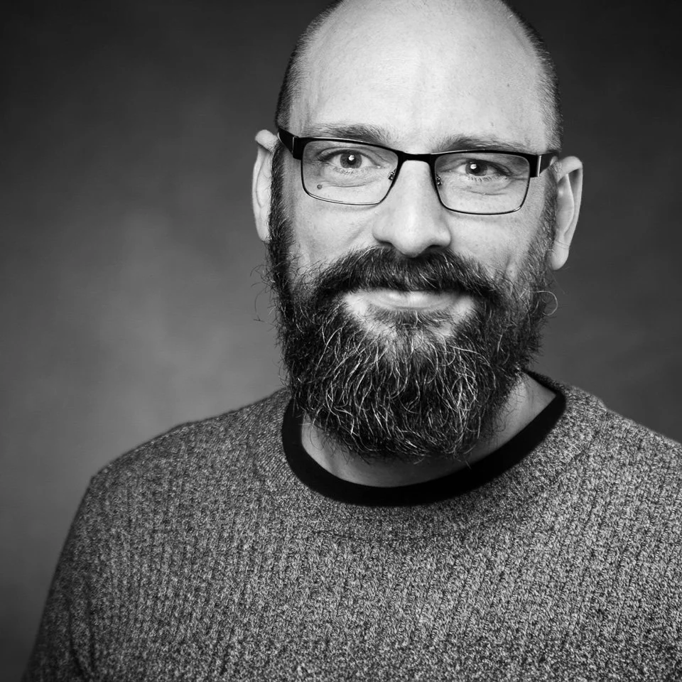 Black-and-white portrait of Owen Davies, Financial Services & Enterprise Specialist.