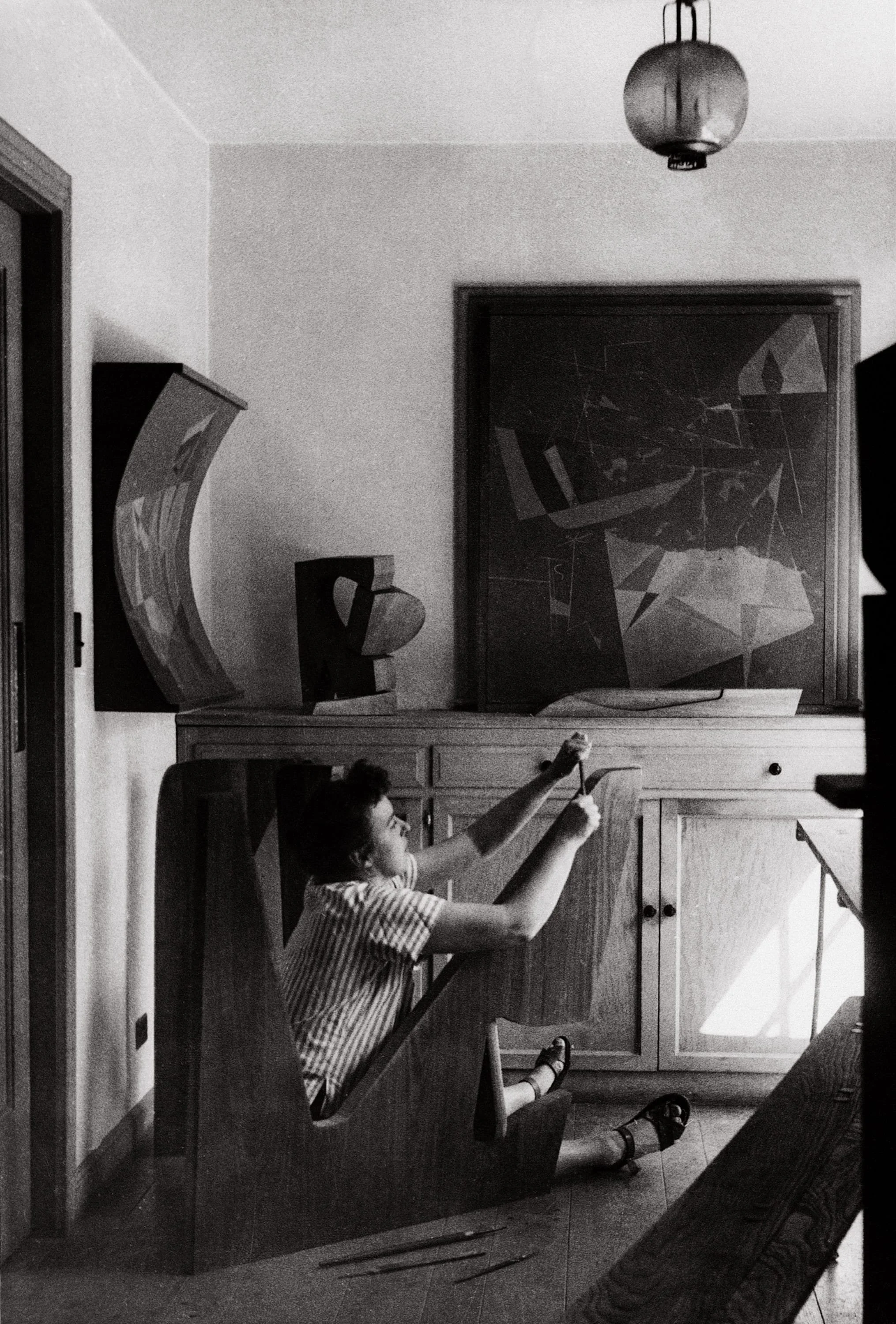Falkenstein constructing a table for Joseph Bransten in her home studio, Berkeley, California, 1948