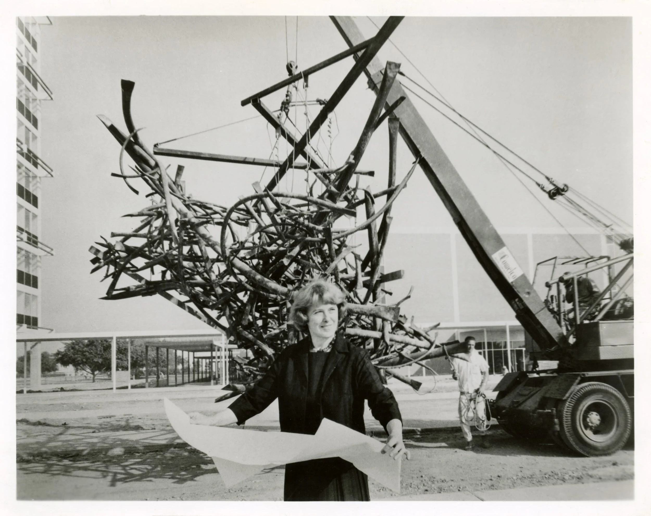 Claire Falkenstein during the installation of  "U" as a Set  on the campus of California State University, Long Beach, 1965. Photo from the collection of Lani Martin