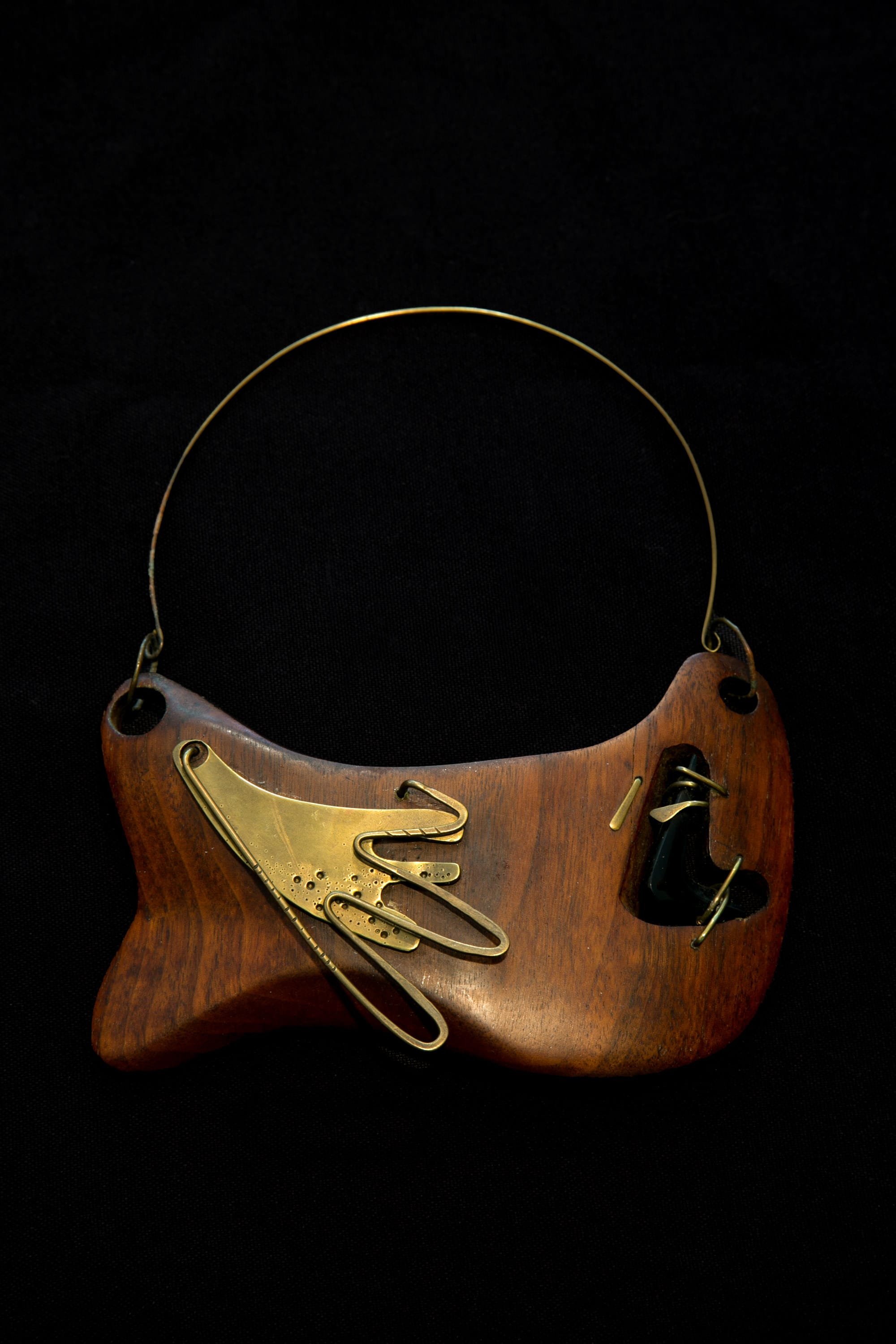  Wood and Brass Necklace with Obsidian , c. 1947 . Wood, brass, and obsidian, 7 × 6 in. (17.8 × 15.2 cm). Private collection 