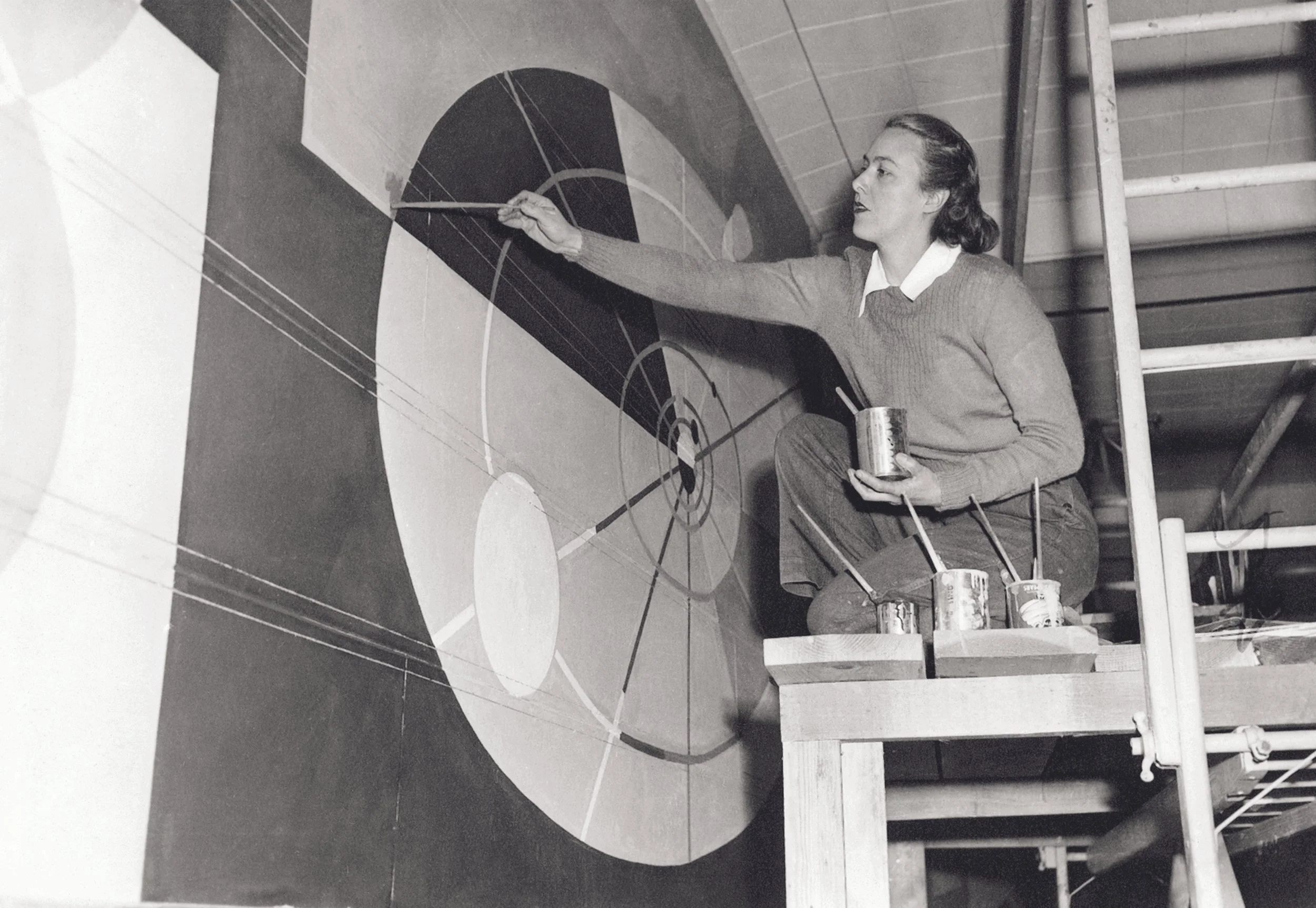 Claire Falkenstein working on  Growth , a mural for the south wall of the theater at U.S. Naval Hospital, San Leandro, California, c. 1945. Claire Falkenstein Papers, Archives of American Art, Smithsonian Institution