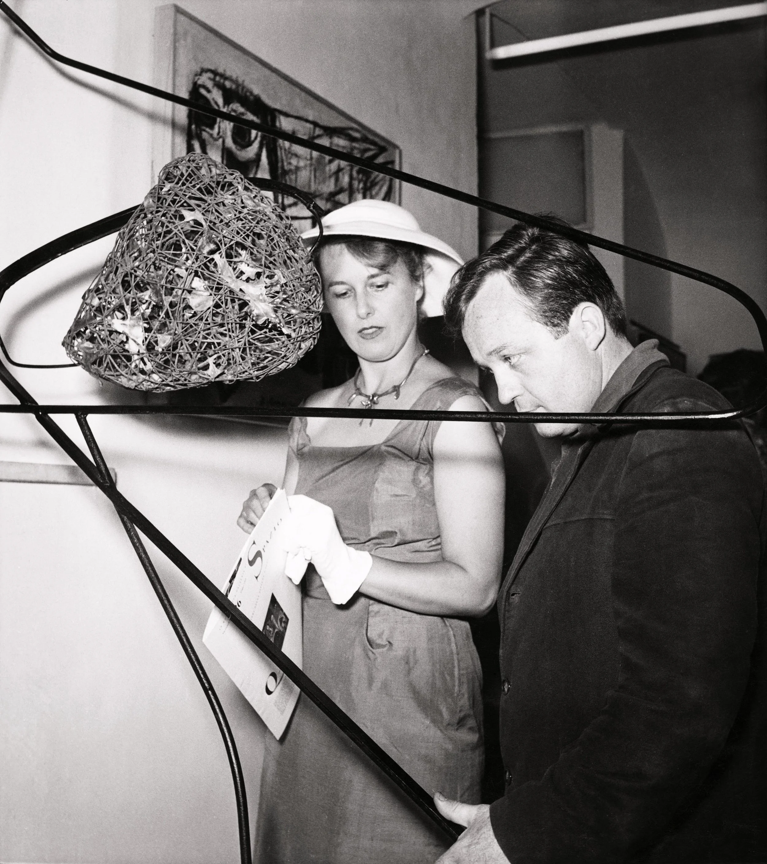 Claire Falkenstein and Sam Francis with Falkenstein's  Stair Screen  at Galleria Spazio, Rome, Italy, 1954