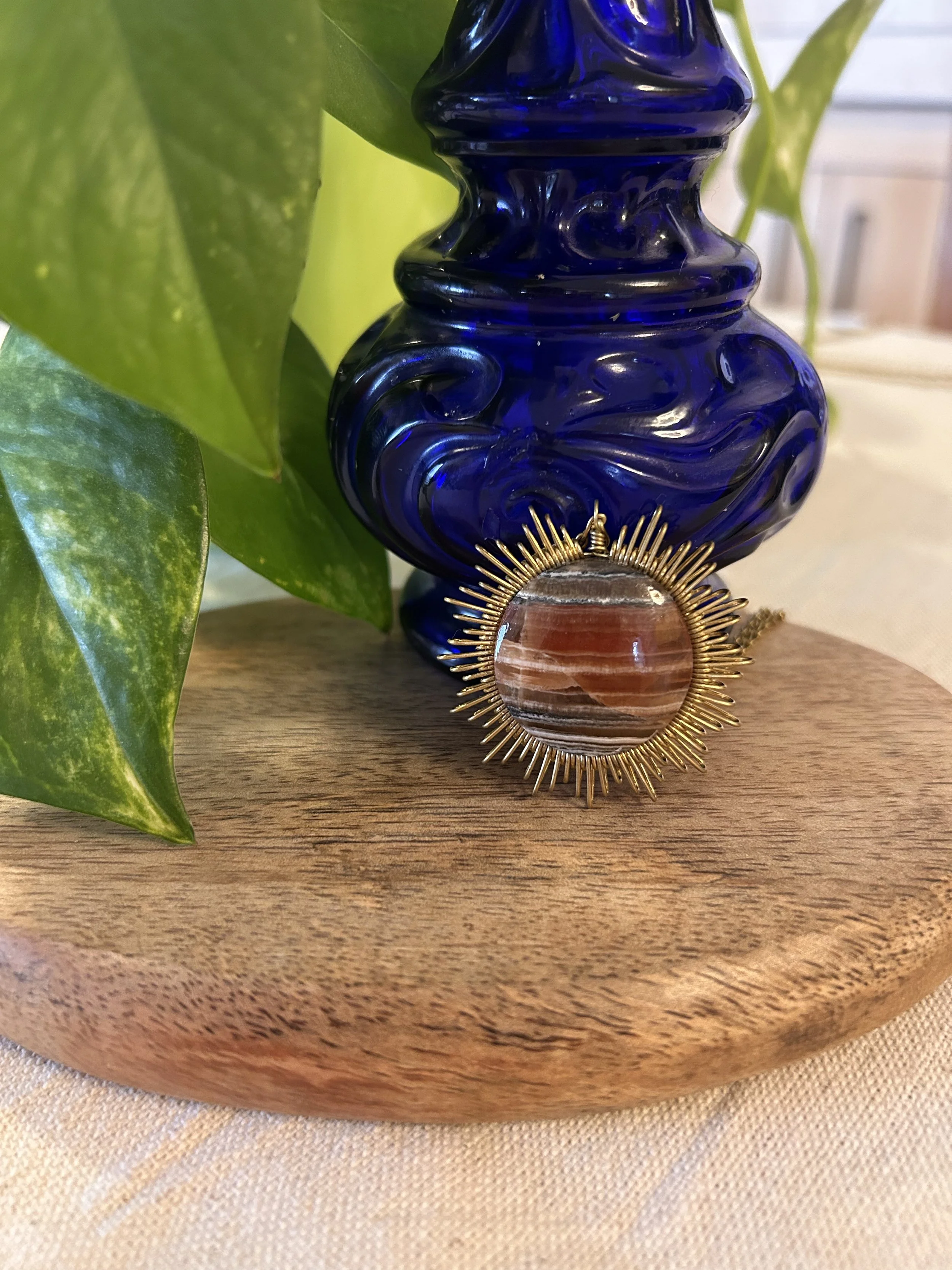 Collier soleil en laiton et onyx caramel