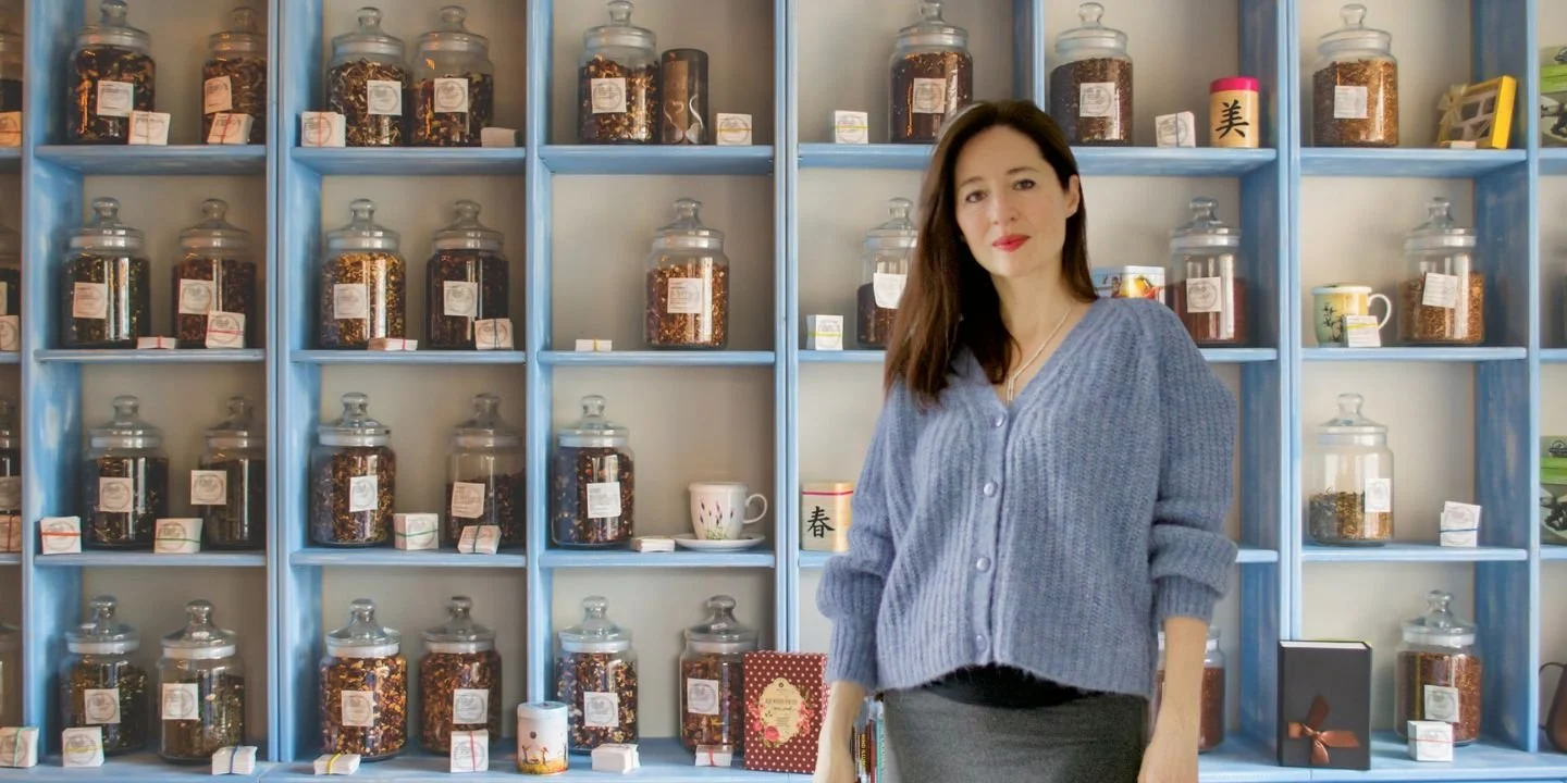 Marina Danilova in front of the shelves with Chinese herbs