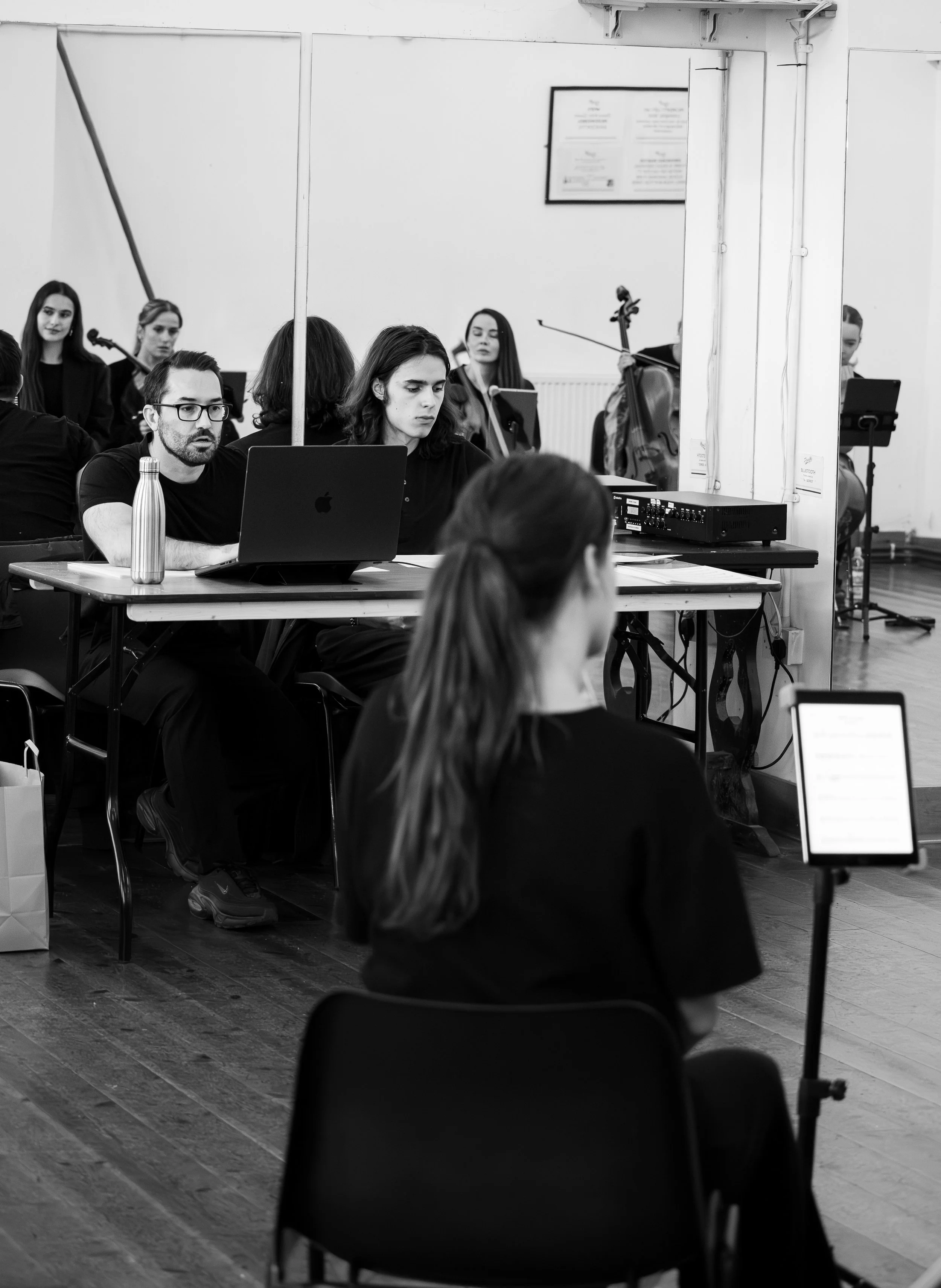 musical director in rehearsals, string musician rehearsals