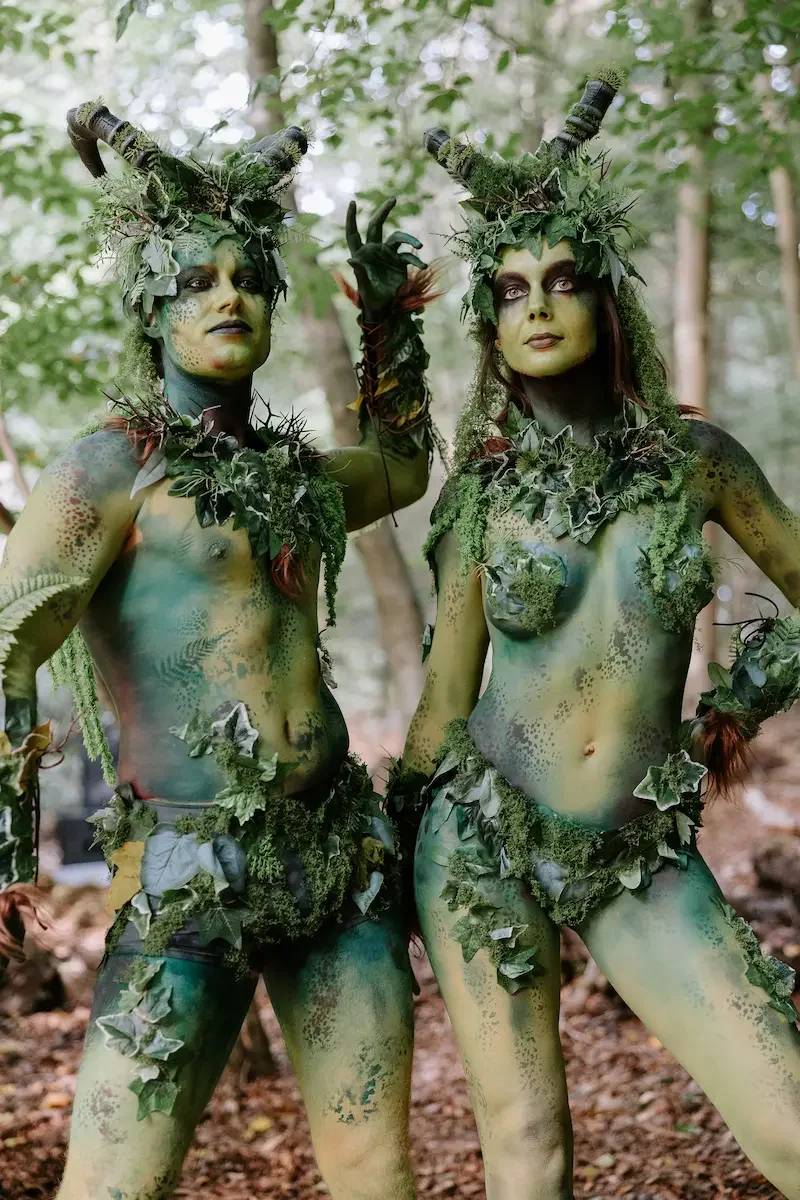 ythical forest creatures with green body paint in woodland storytelling experience