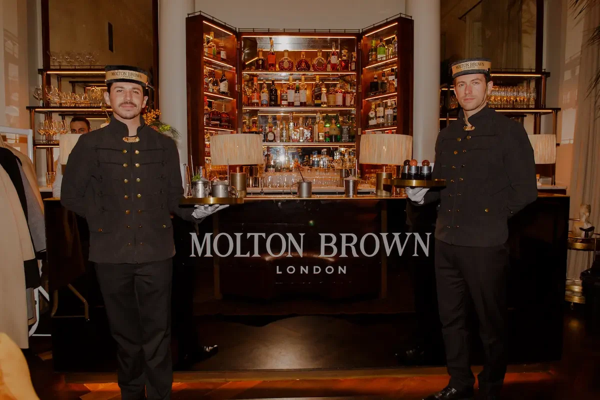 Brand ambassadors presenting luxury products at elegant bar setting