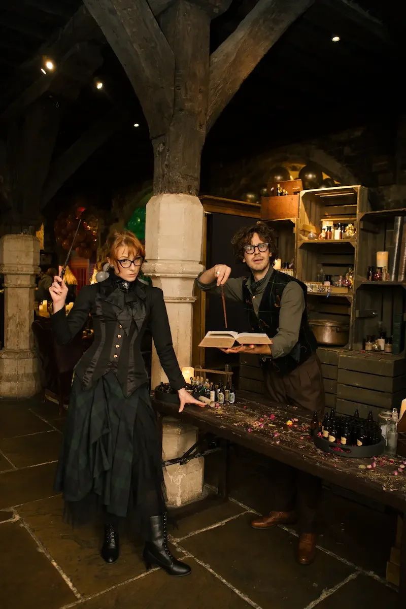 Wizard-costumed performers in a fantasy-themed setting for an immersive experience in London.