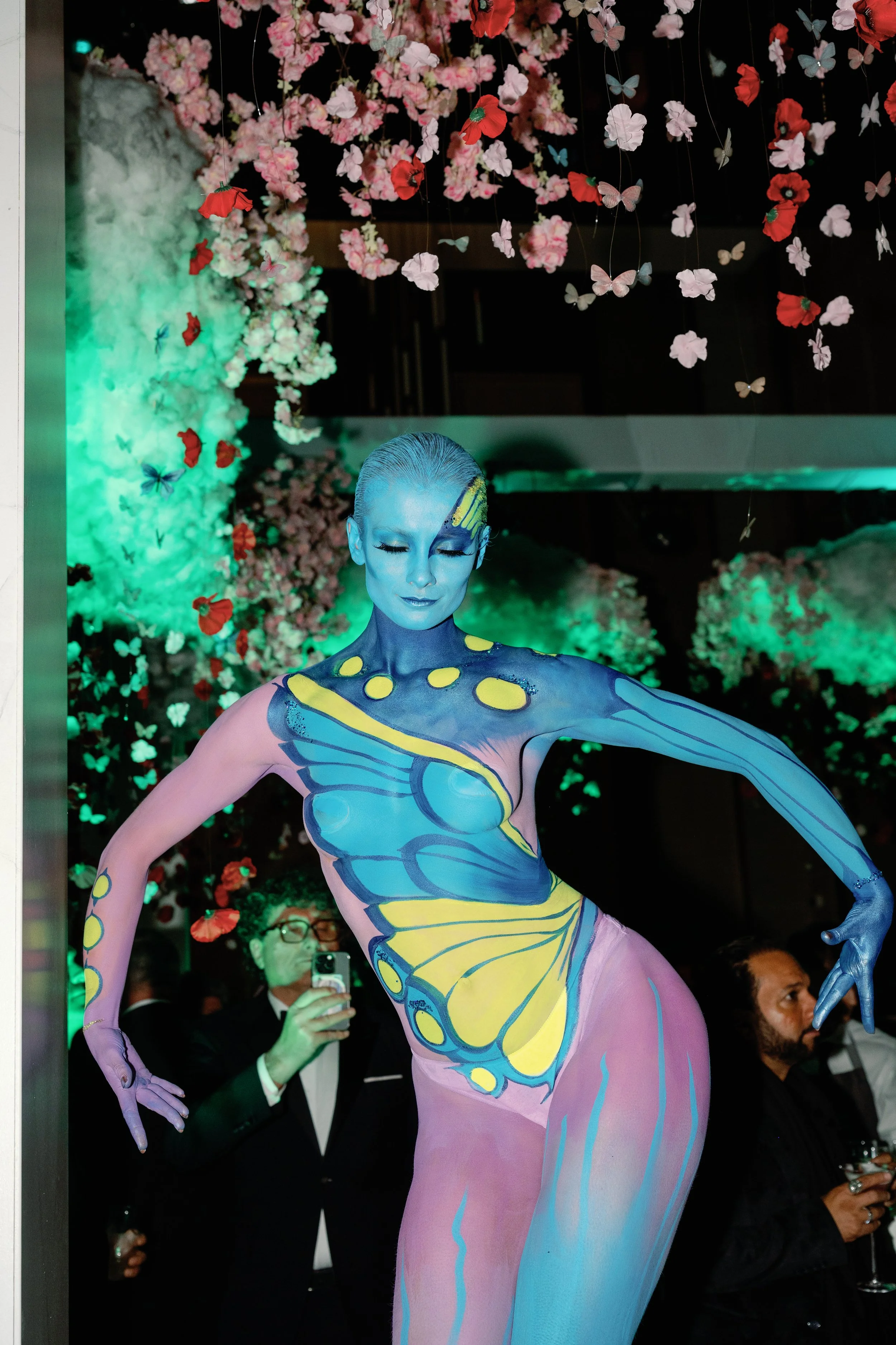 colourful body painted butterfly dancer