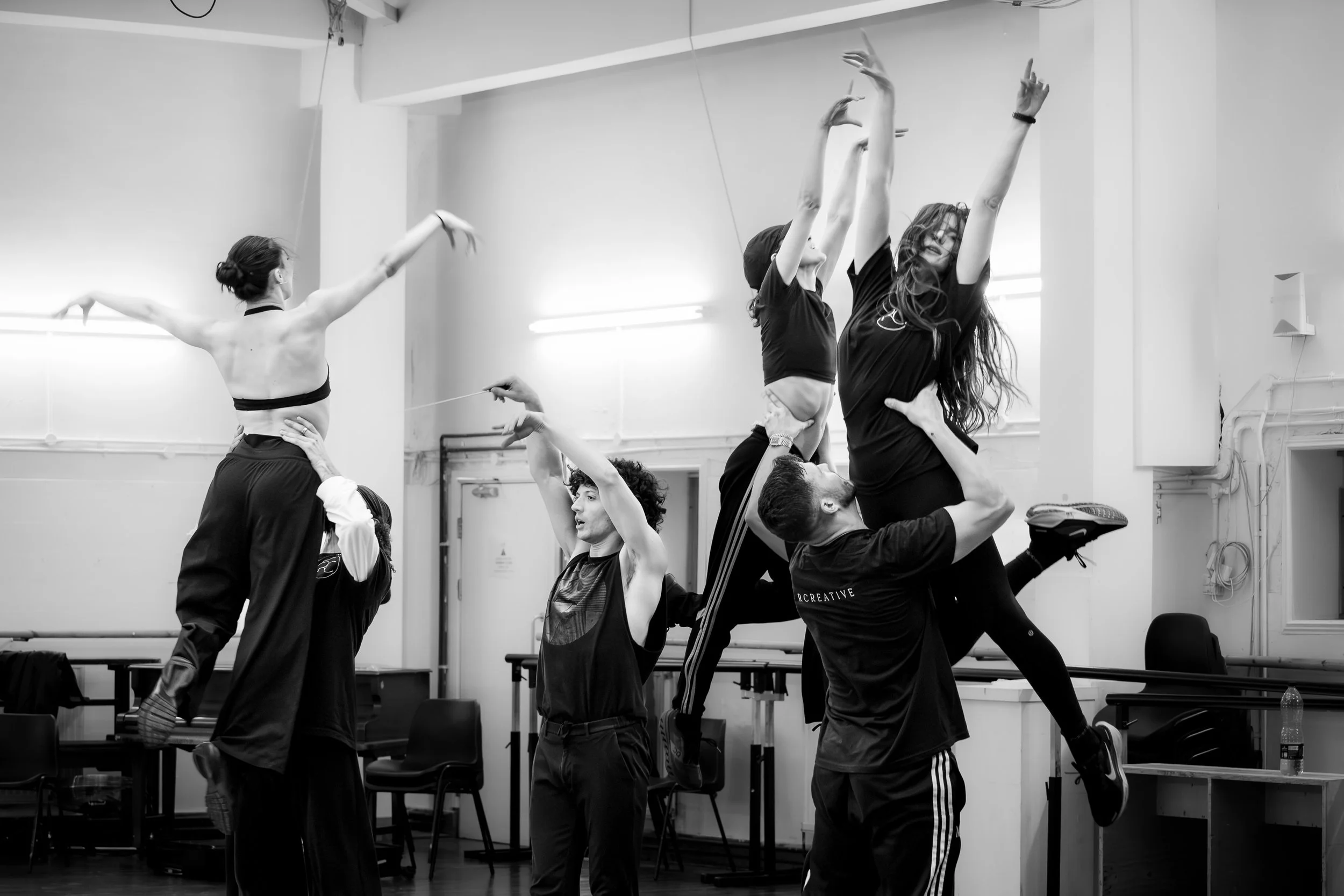 dancers in a studio rehearsing for a show
