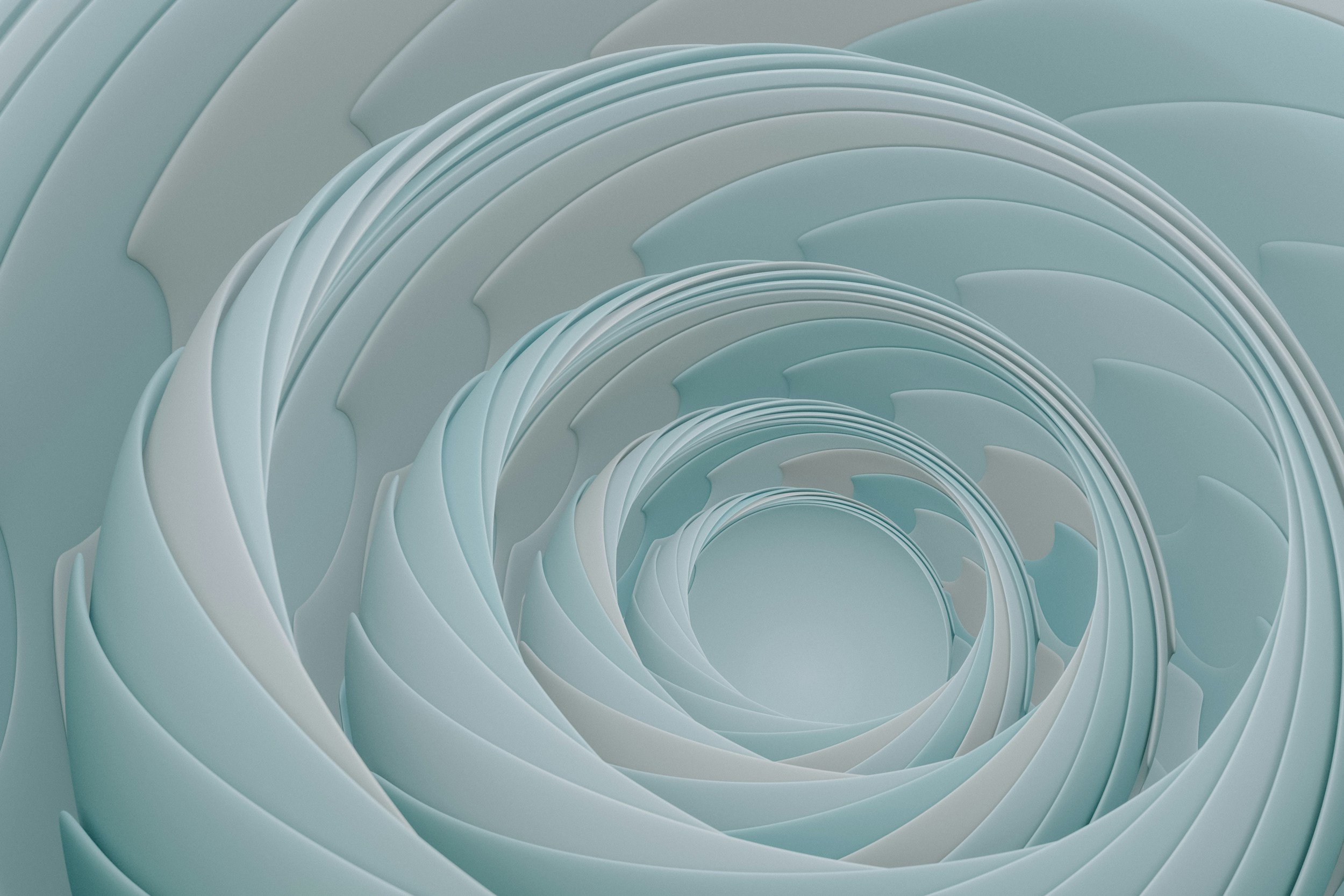 Abstrakt billede af snoede, lyseblå og hvidlige lag, der danner en spiralform.