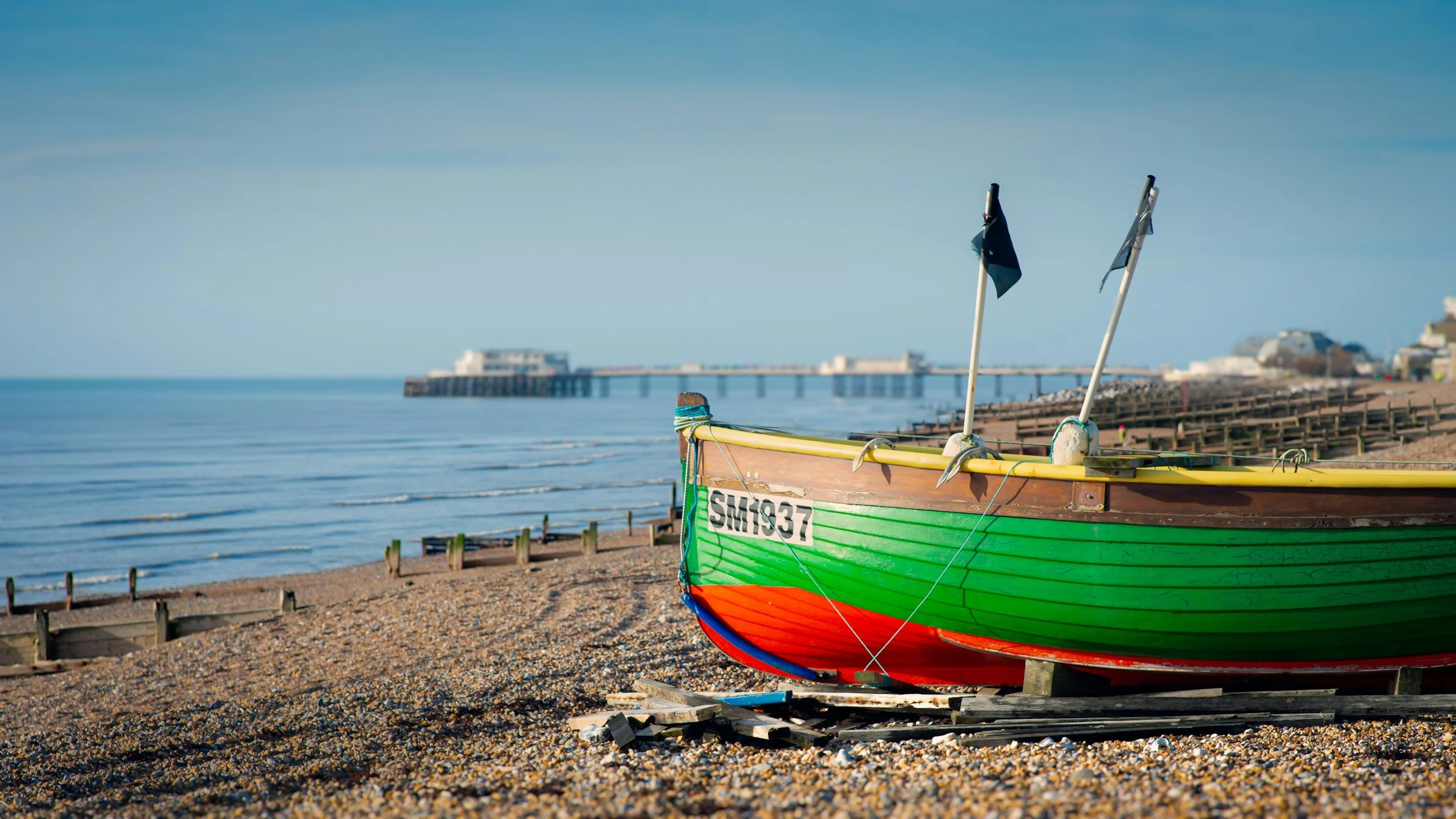Close up of green and red boat by the sea