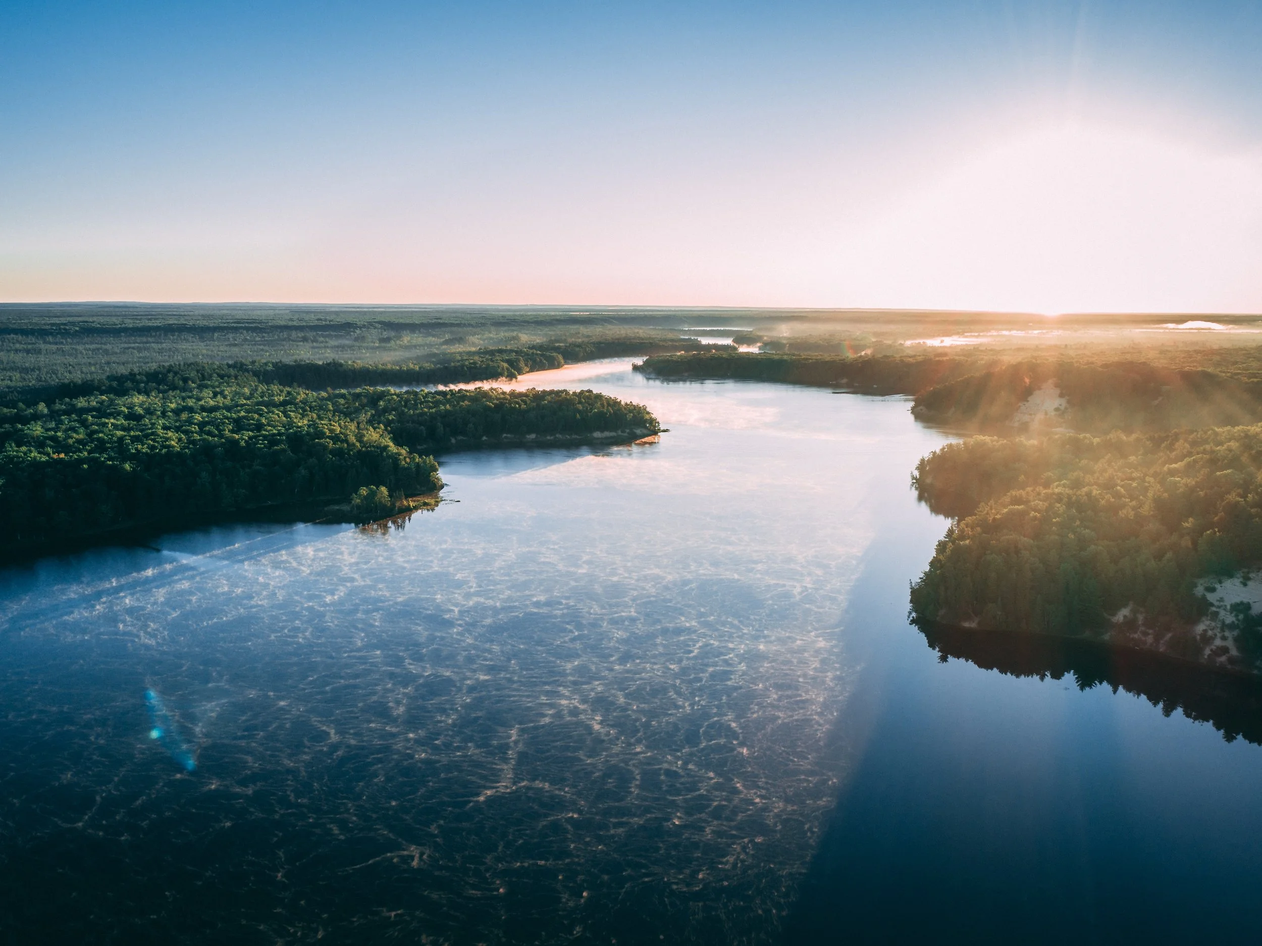aerial-picture-river-surrounded-by-islands-covered-greenery-sunlight.jpg