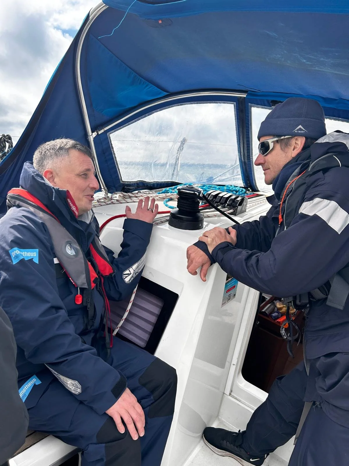 Two people talking in the cockpit during Sea Trials