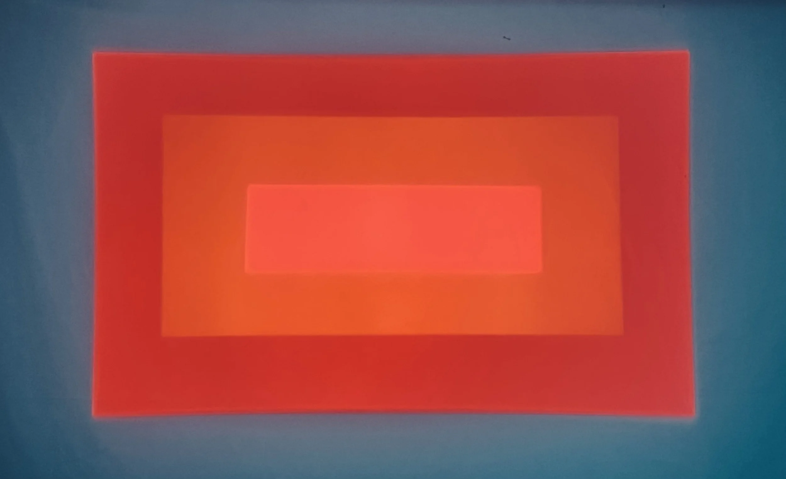 Abstract digital artwork with overlapping red and orange rectangular shapes on a blue background. Light art. Lux festival. Sampo Aatos.